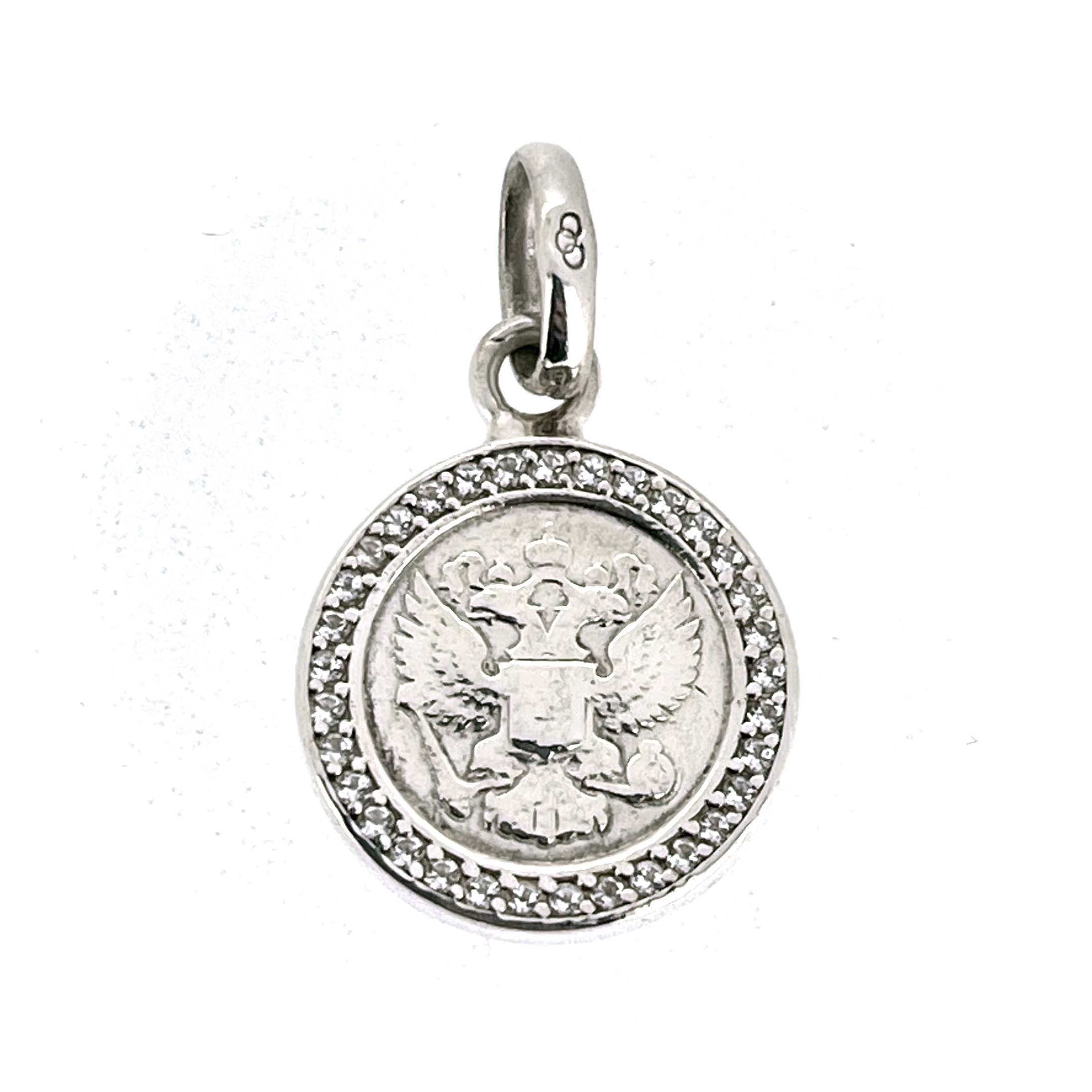 Angled view of vintage Moskova Imperial Rouble charm with standard oval bail