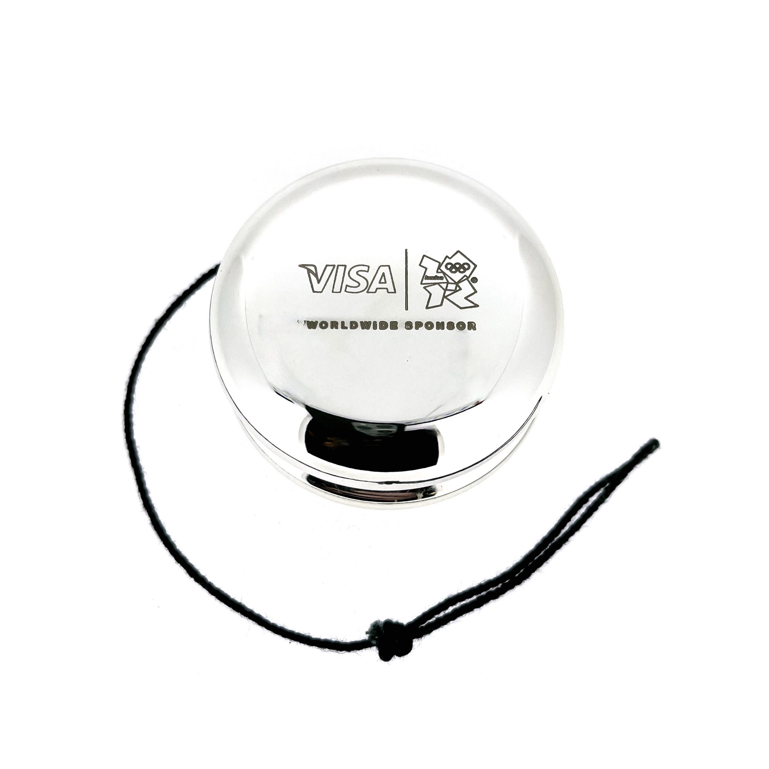 Side profile of silver plated yo-yo showing thickness