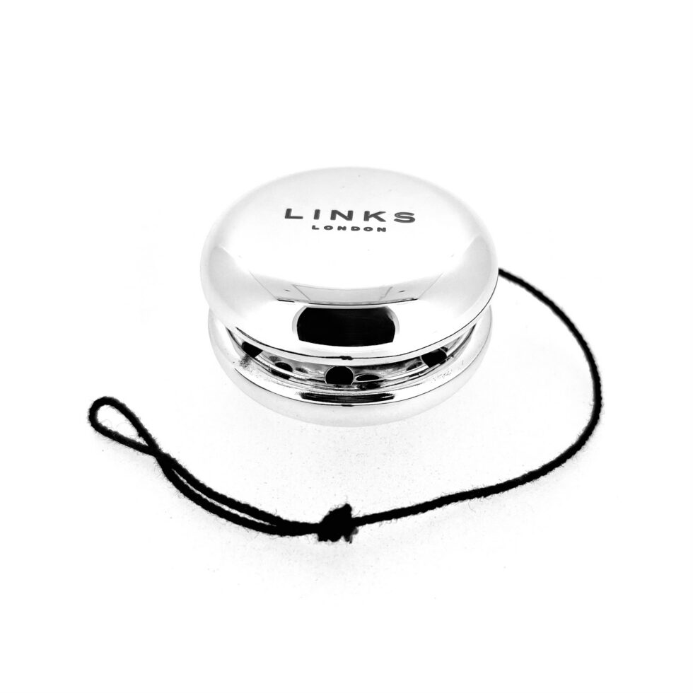 Side profile of silver plated yo-yo showing thickness