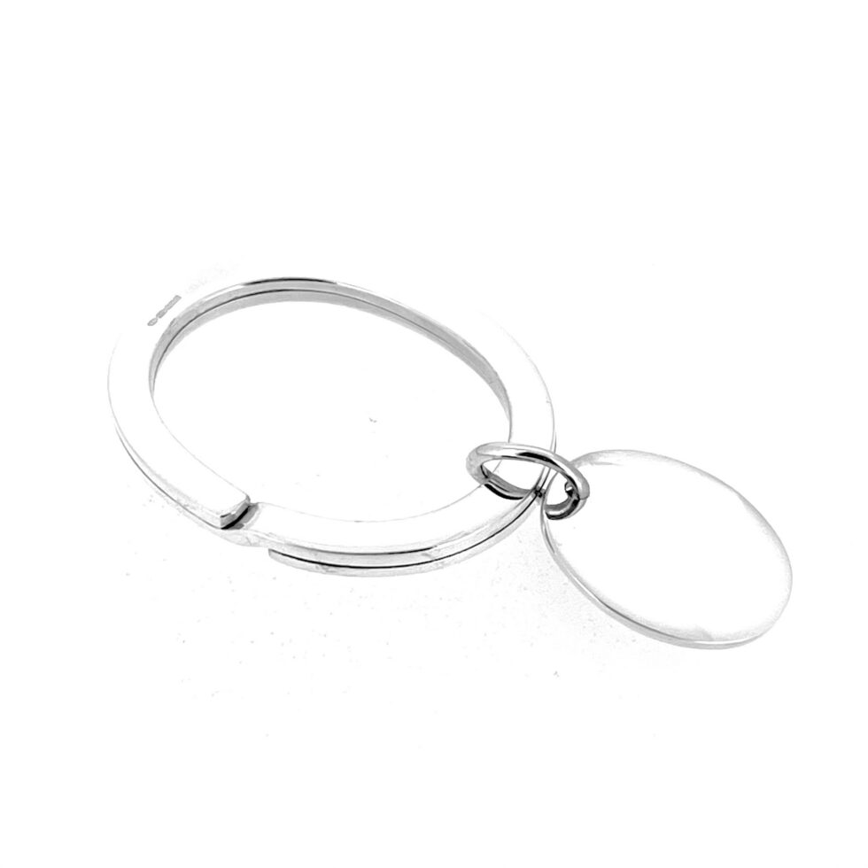 Front view of Royal Variety Performance 1999 engraved silver fob on oval keyring