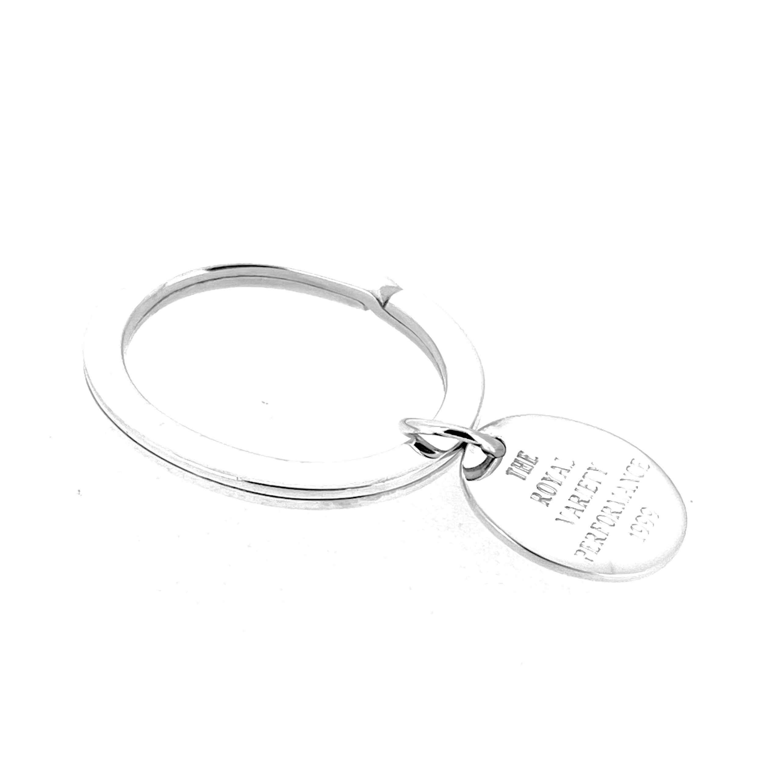 Close view of engraved fob reading The Royal Variety Performance 1999