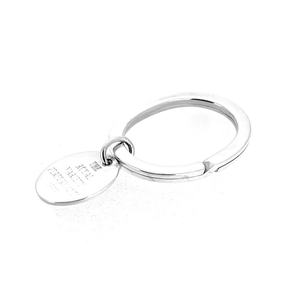 Side view of sterling silver oval keyring with suspended engraved tag
