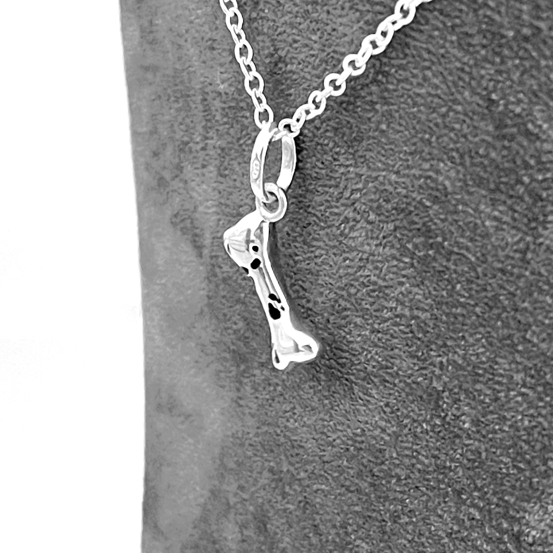 Small sterling silver bone necklace with black enamel front view