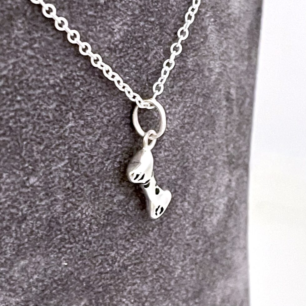 Vintage sterling silver dog bone necklace with black enamel detail