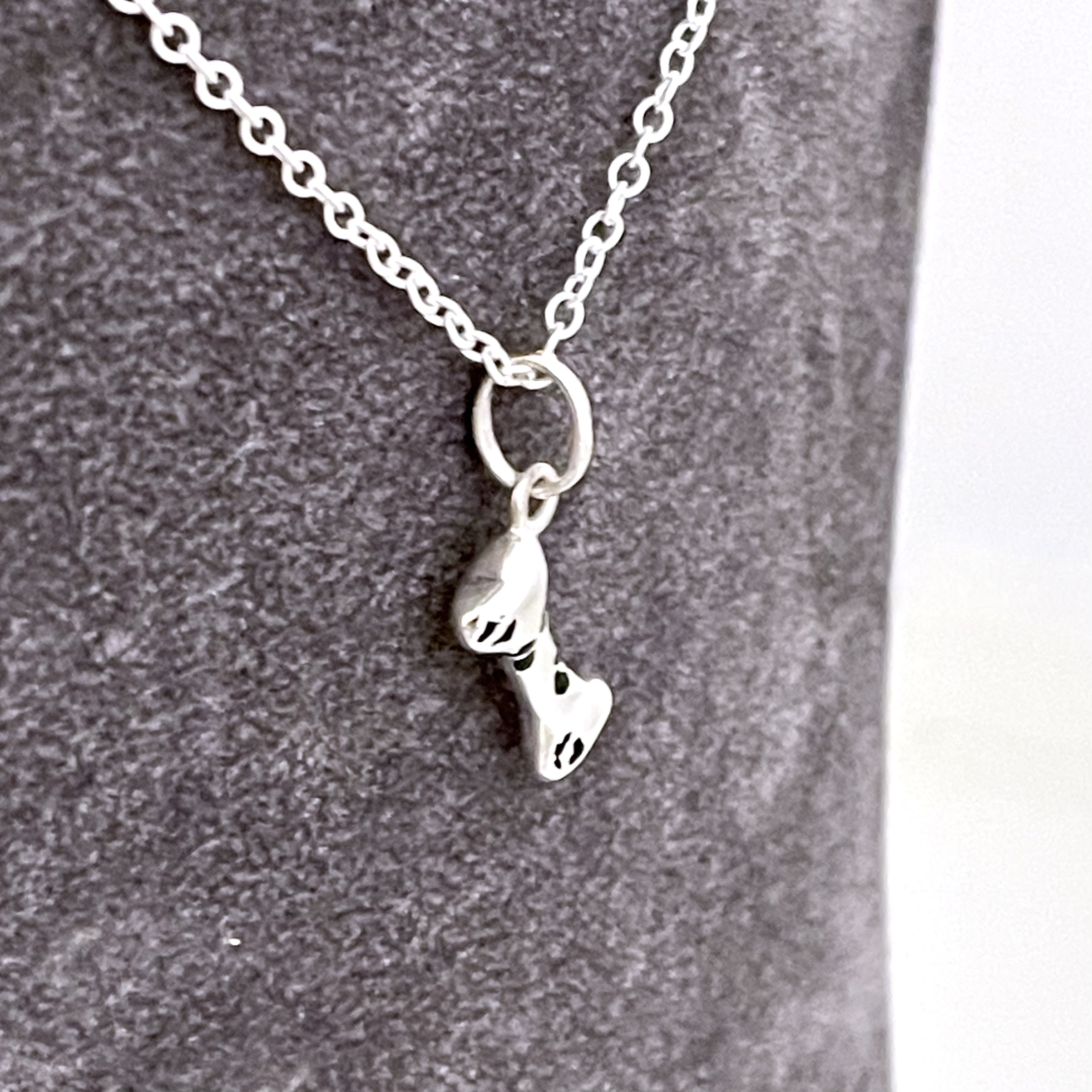 Vintage sterling silver dog bone necklace with black enamel detail