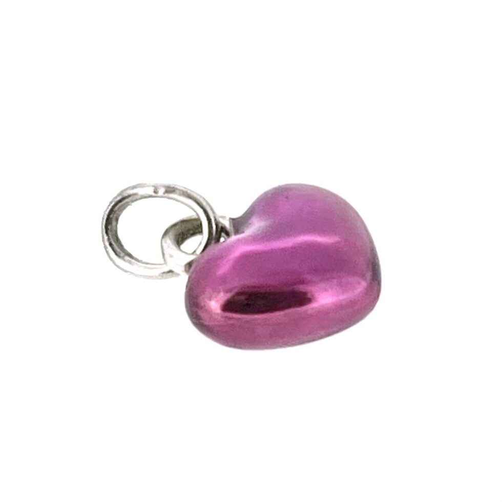 Angled view of sterling silver puffed heart charm with translucent purple enamel