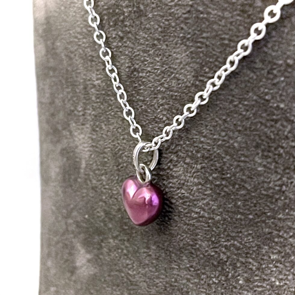 Close view of translucent purple enamel on Links of London mini heart necklace