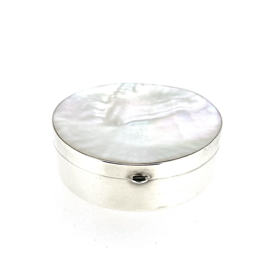 Vintage silver box with round body and shell-like mother-of-pearl lid