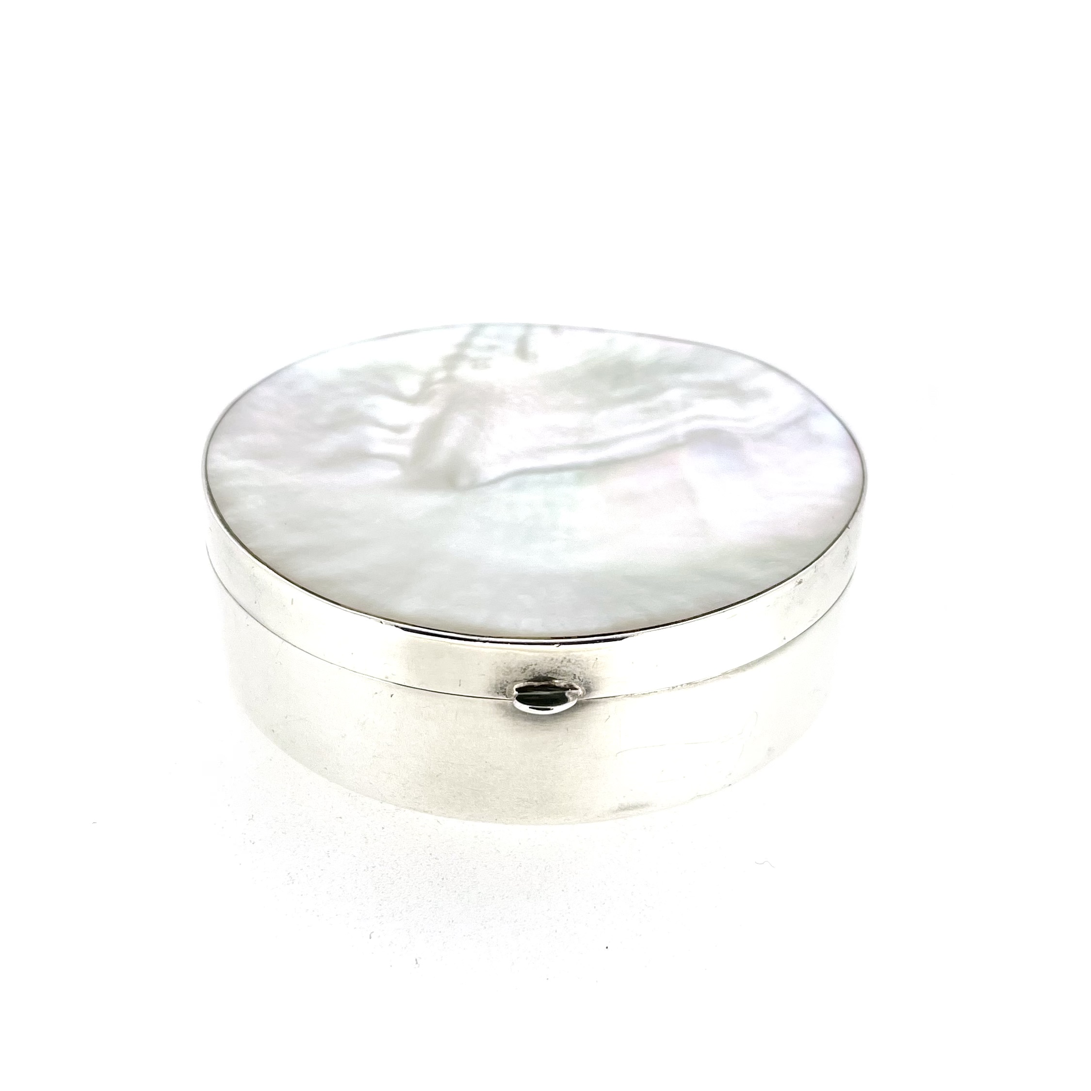Vintage silver box with round body and shell-like mother-of-pearl lid