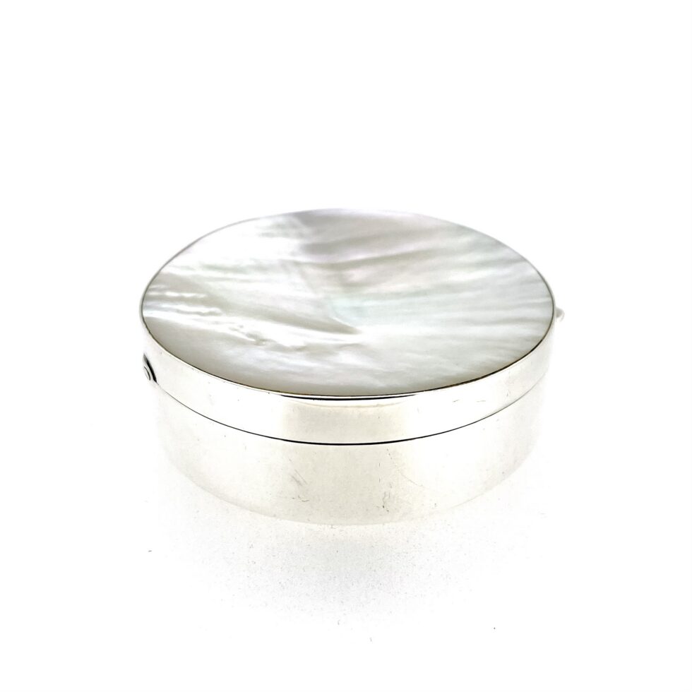 Side angle of Links of London hinged silver box with mother-of-pearl lid