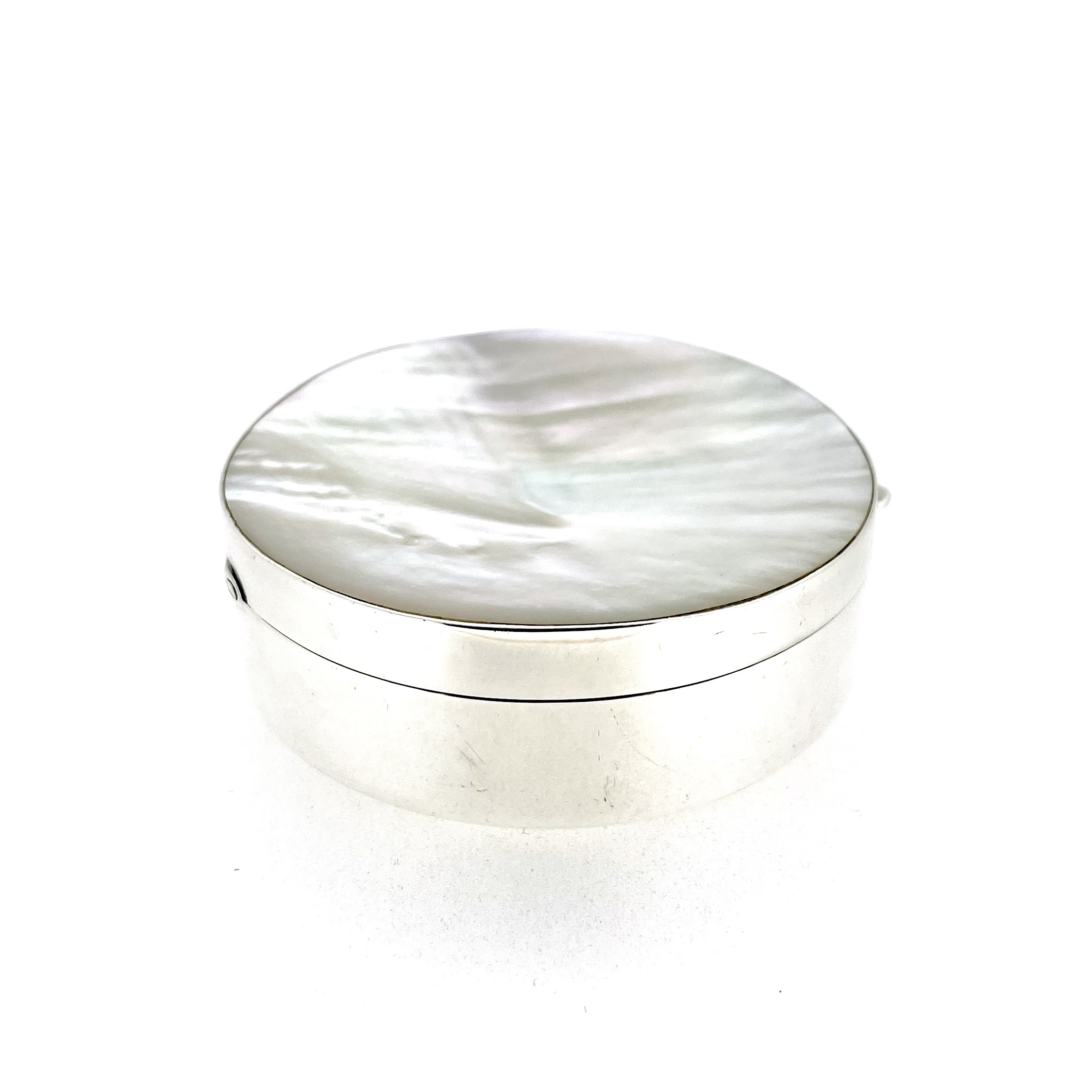 Side angle of Links of London hinged silver box with mother-of-pearl lid