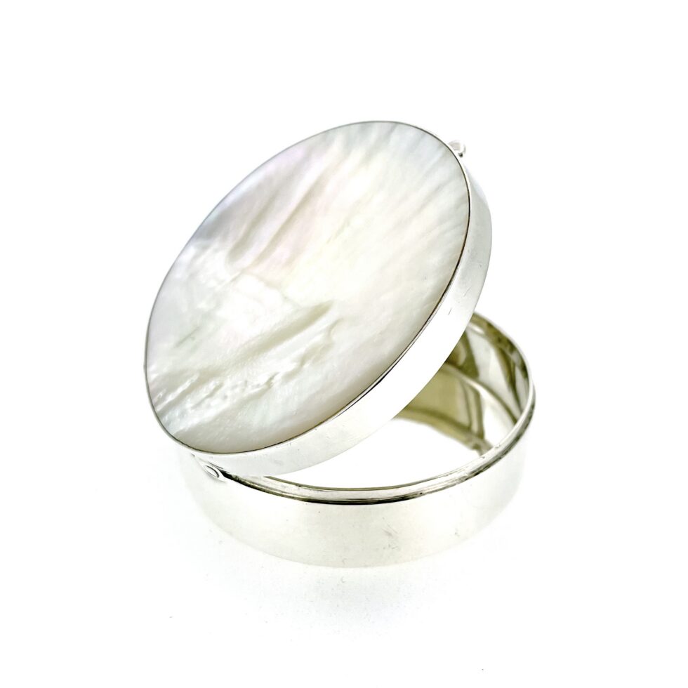 Vintage silver box with round body and shell-like mother-of-pearl lid
