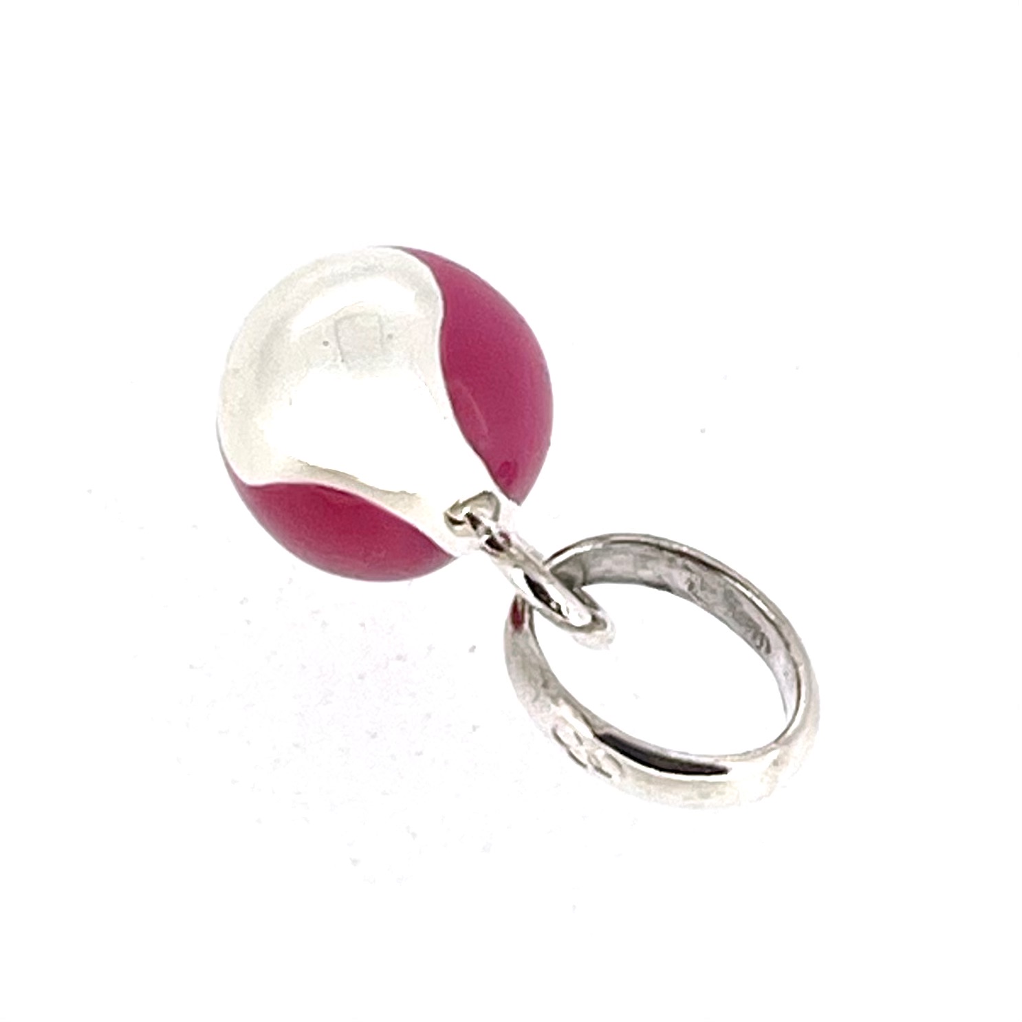 Side view of Links of London tennis ball charm showing curved seam detail