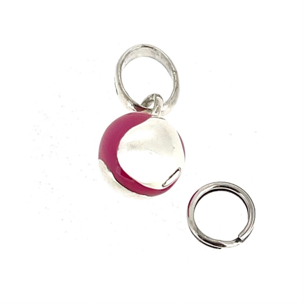 Compact sterling silver tennis ball charm suitable for bracelet or necklace wear