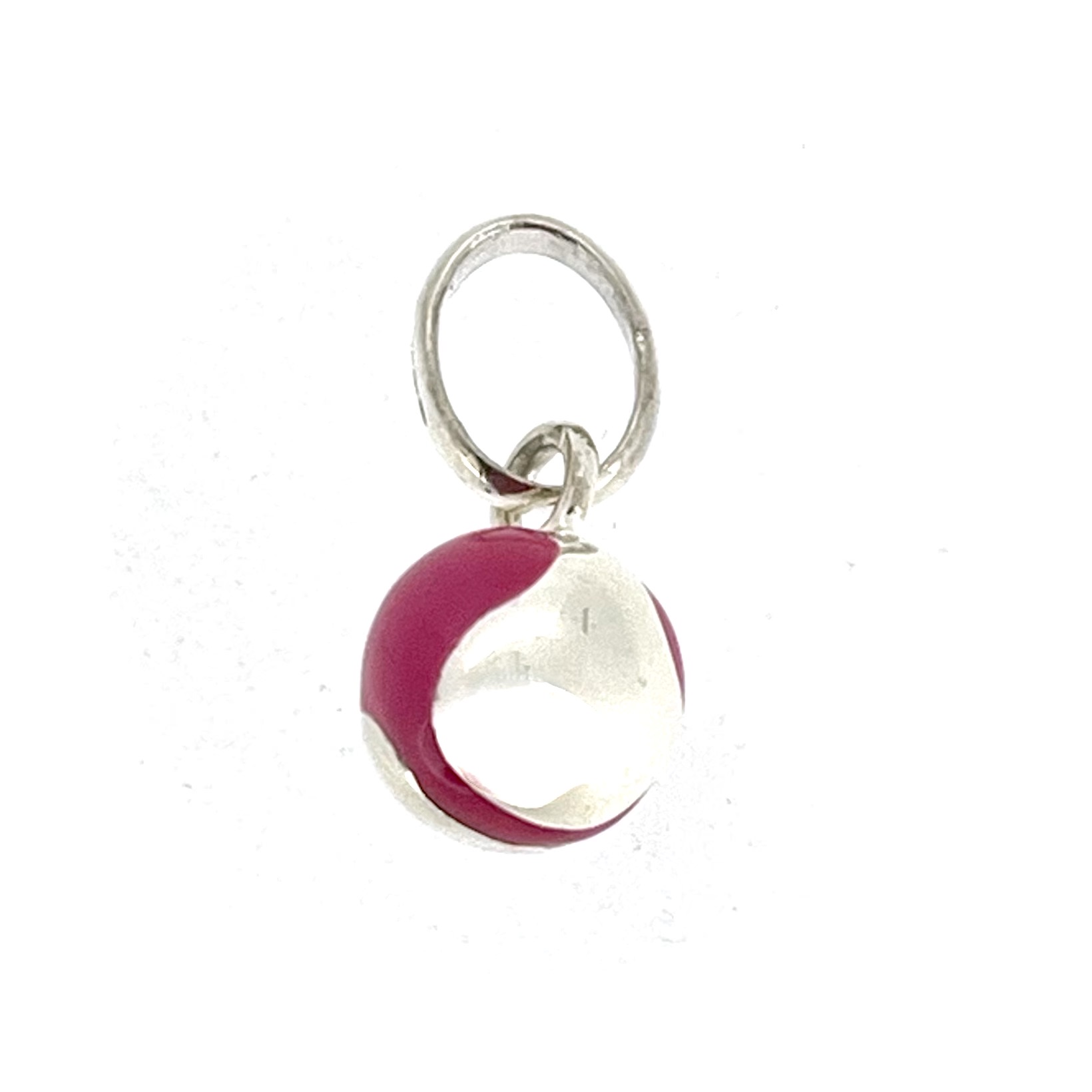 Links of London pink enamel tennis ball charm viewed from slight angle