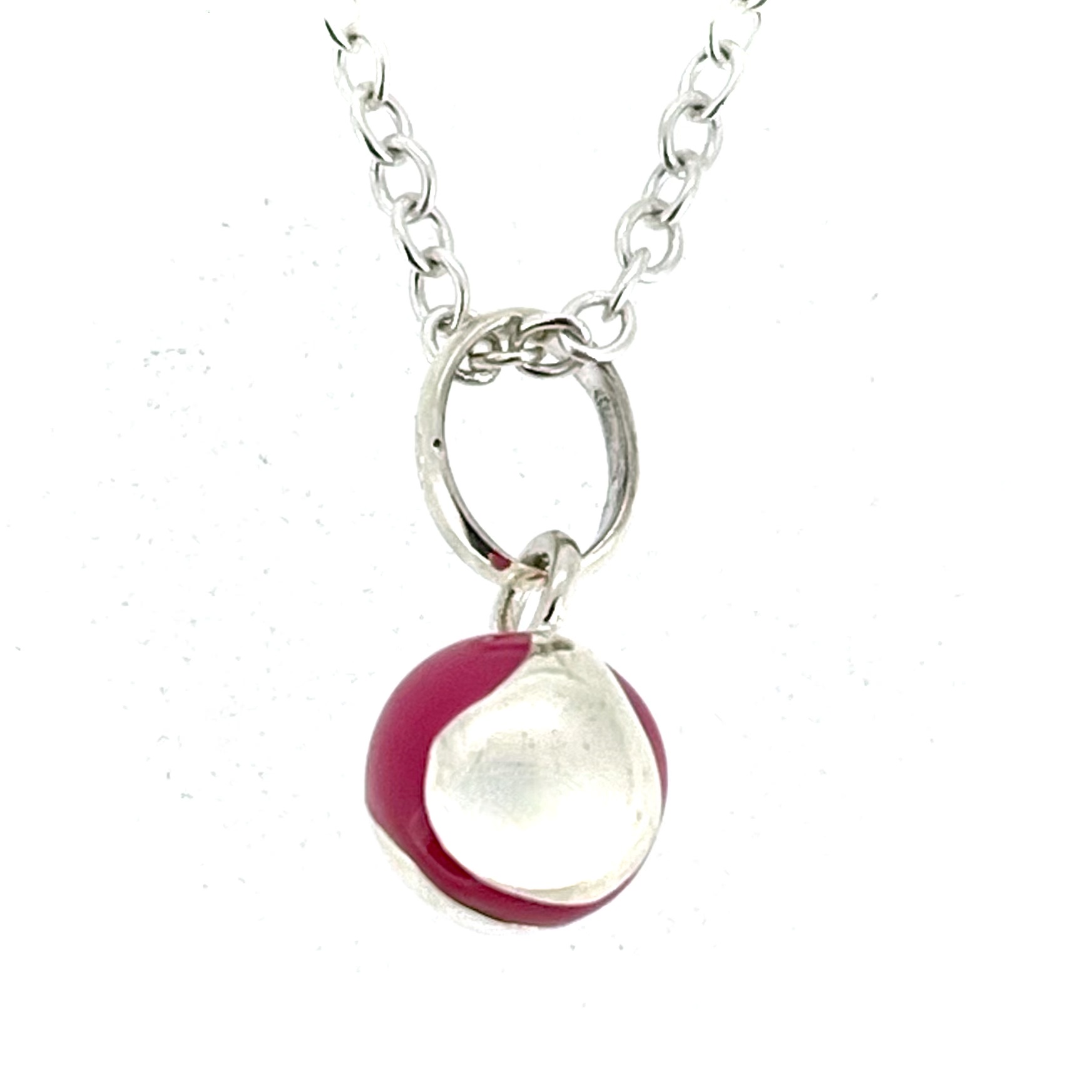 Small pink enamel tennis ball necklace front view