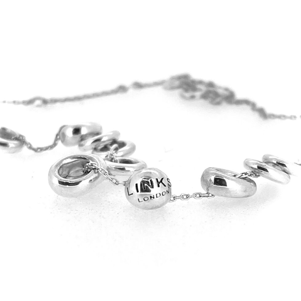Close view of central Sweetie Links detail on sterling silver necklace