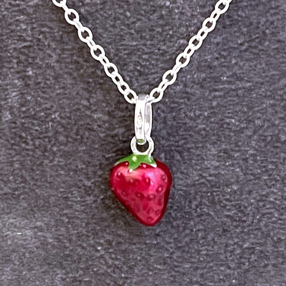 Red and green enamel strawberry necklace front view