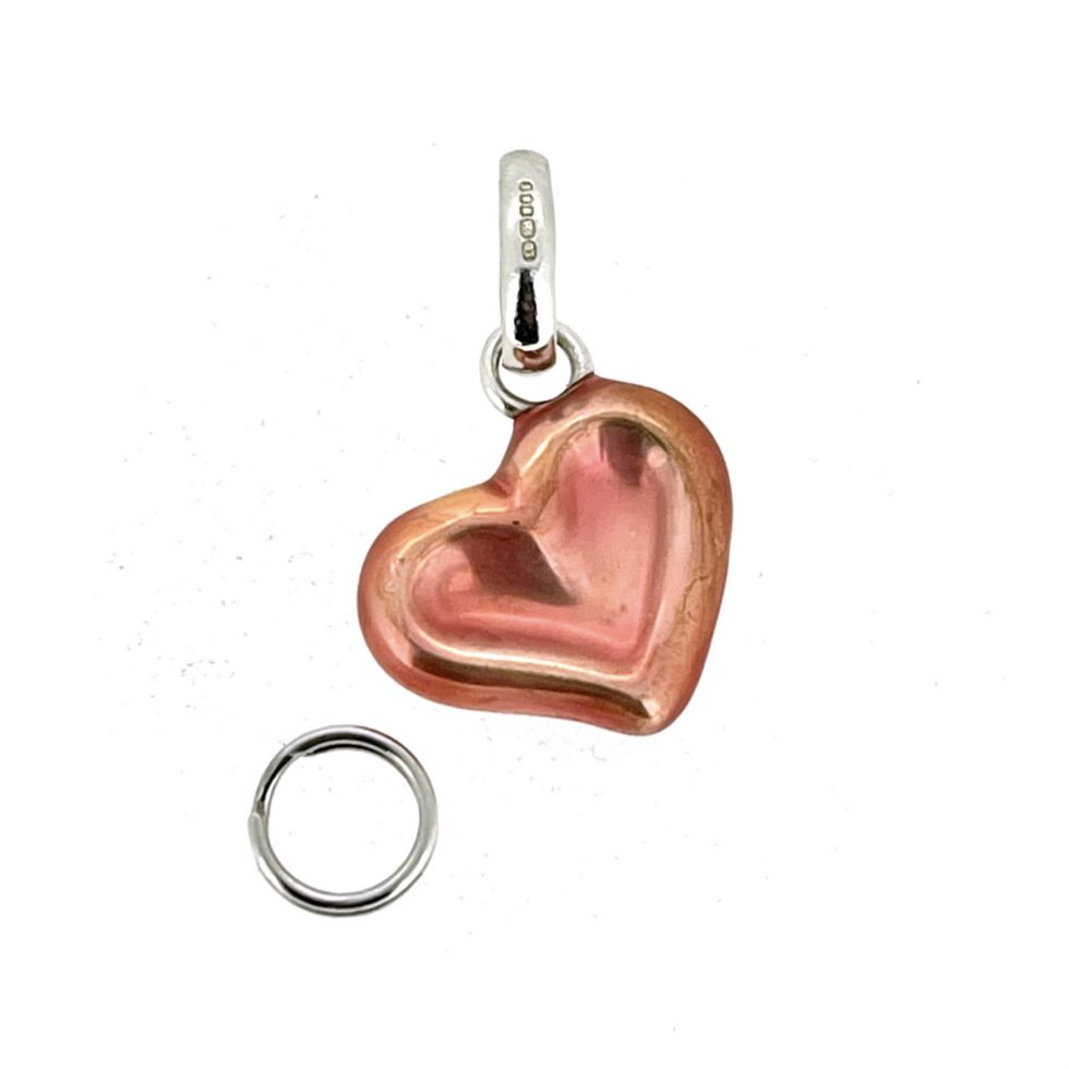 Thumbprint heart charm warm red enamel close up