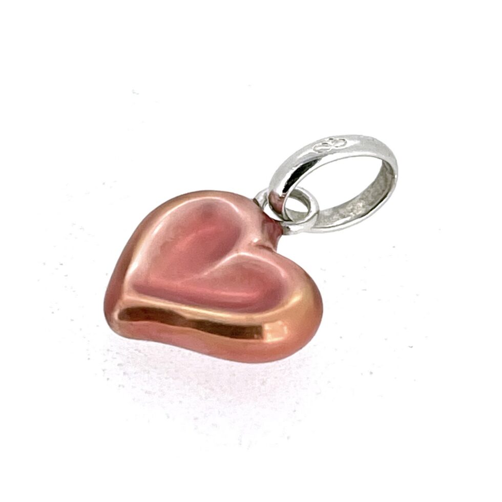 Silver and red enamel charm curved form detail