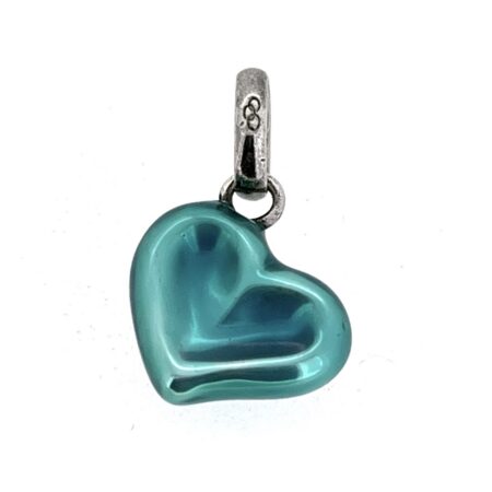 Vintage heart charm showing enamel wear detail