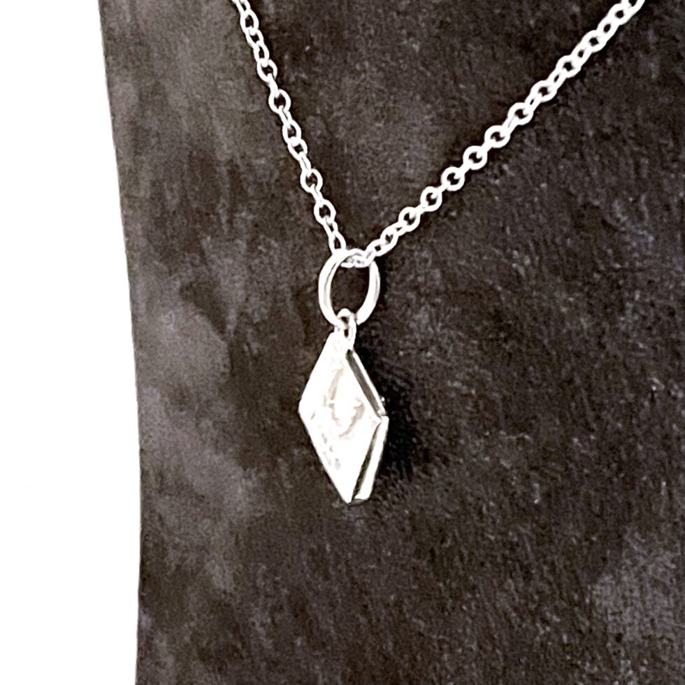 Links London inscribed bag charm presented as a finished necklace