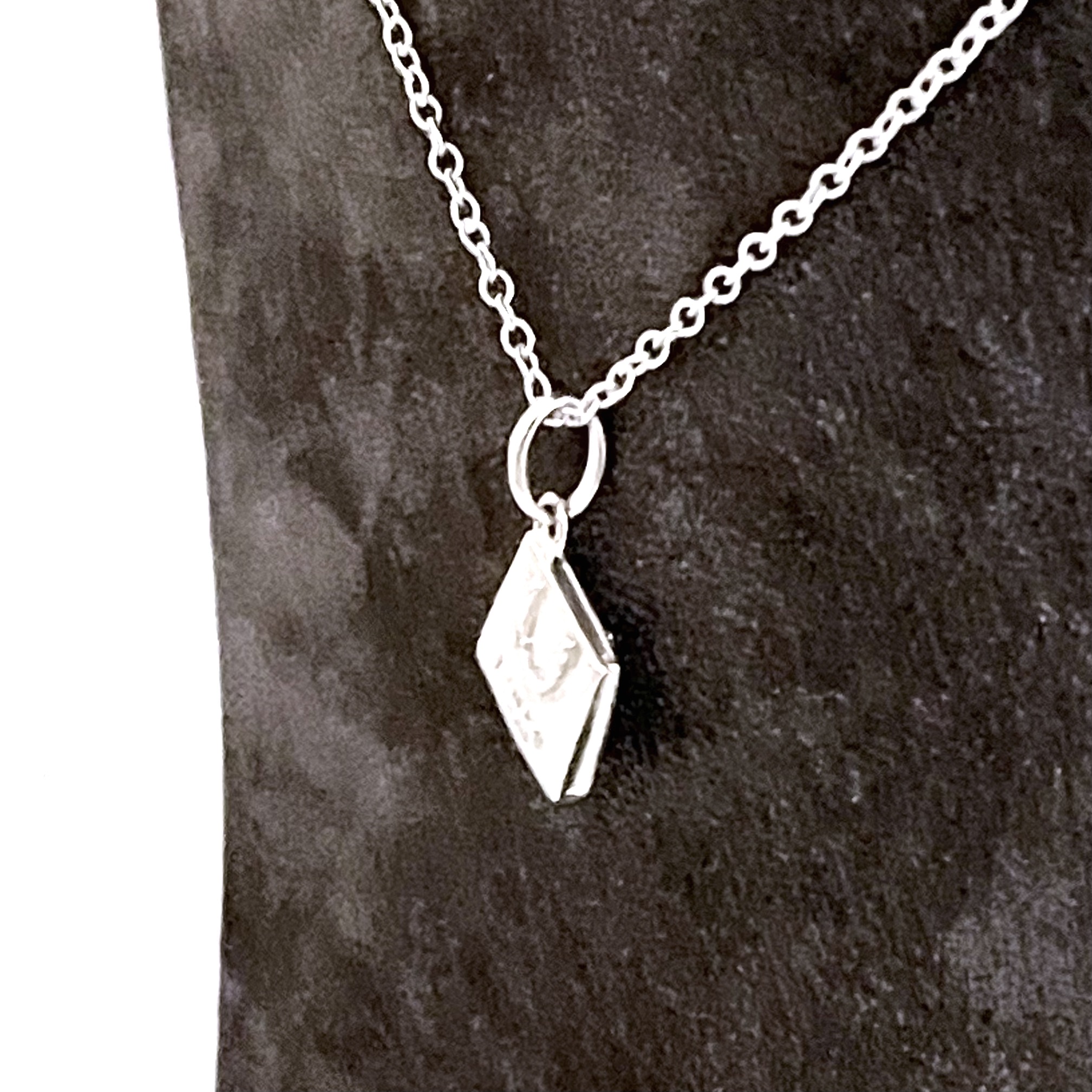 Links London inscribed bag charm presented as a finished necklace