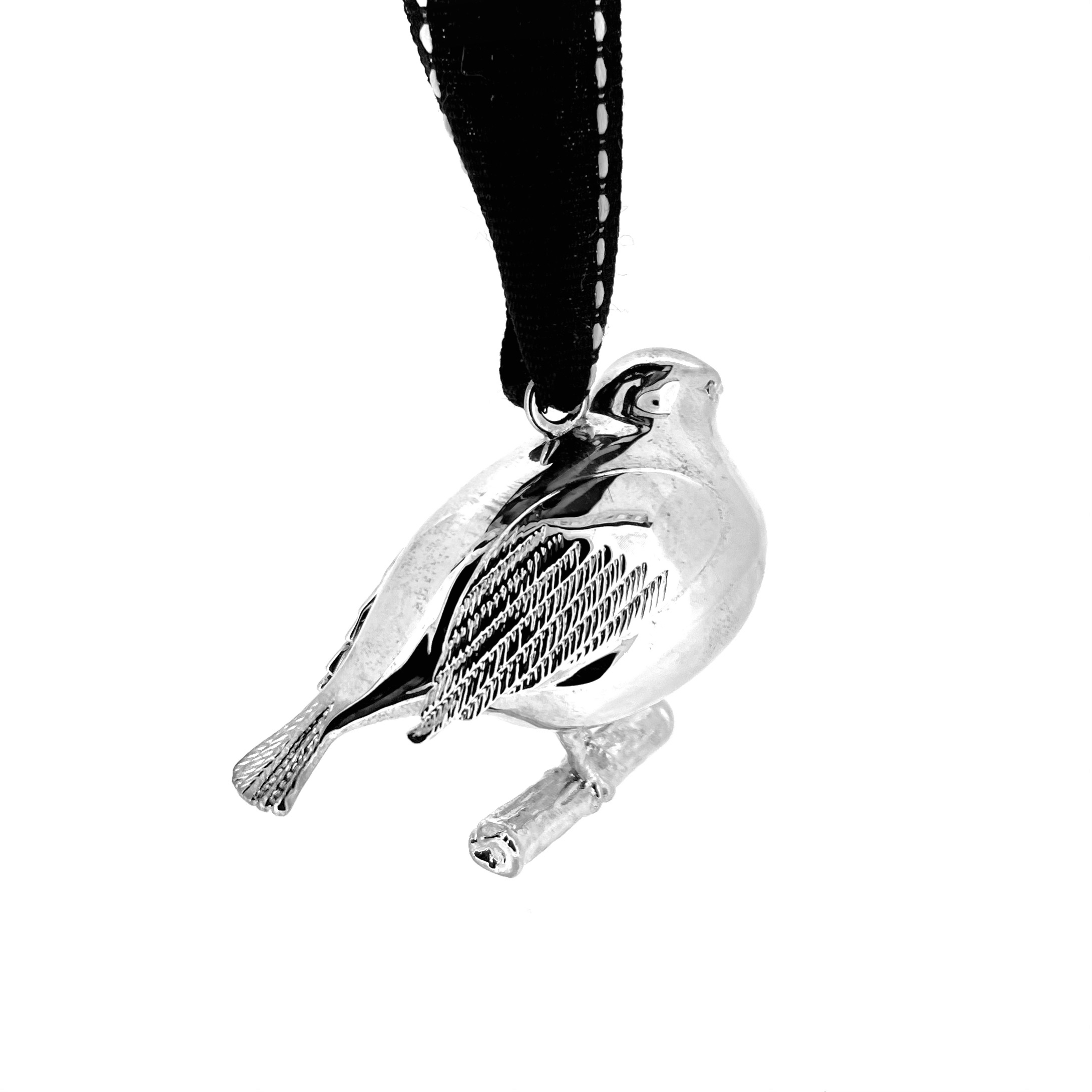 Side profile of vintage robin bauble showing perched bird design