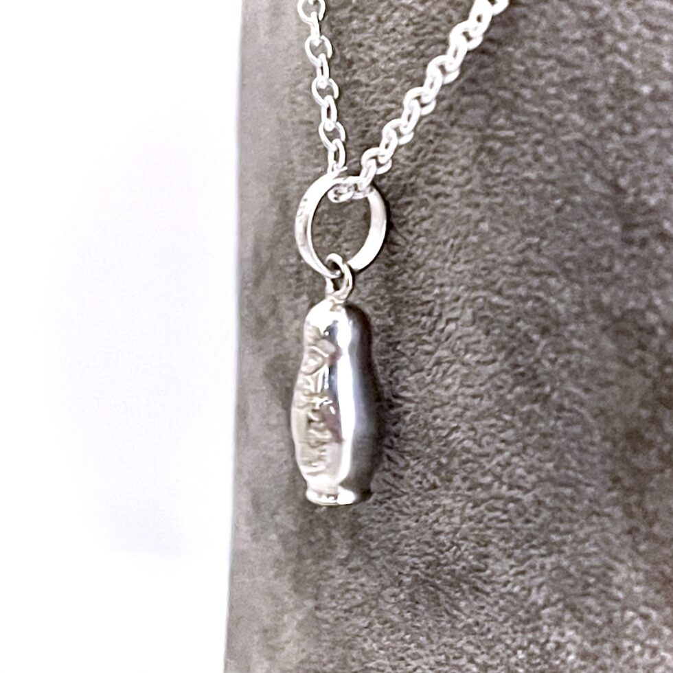 Russian Doll charm presented as a finished Links of London necklace