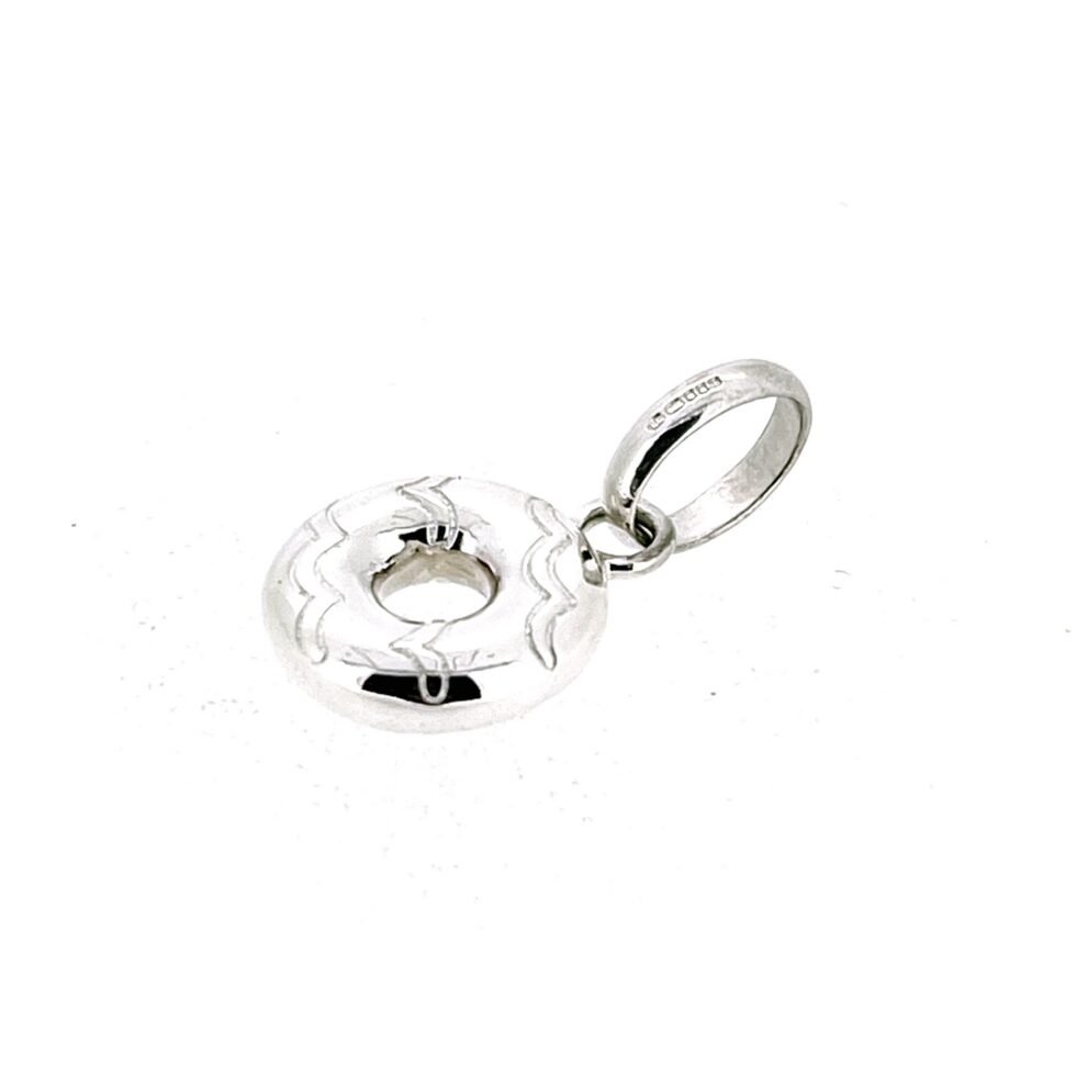 Polished sterling silver doughnut charm with engraved decoration