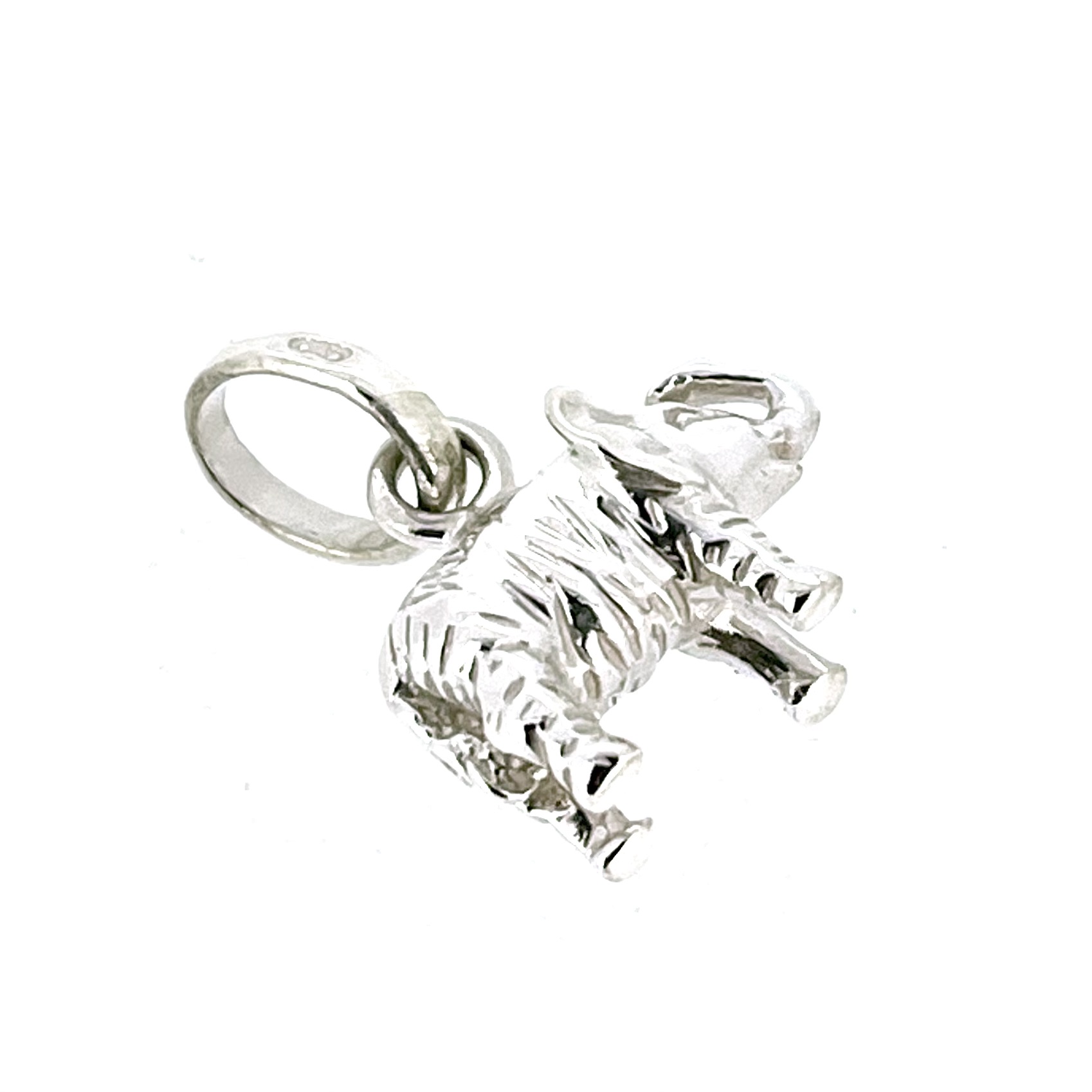 Side profile of vintage elephant charm showing compact sculptural form