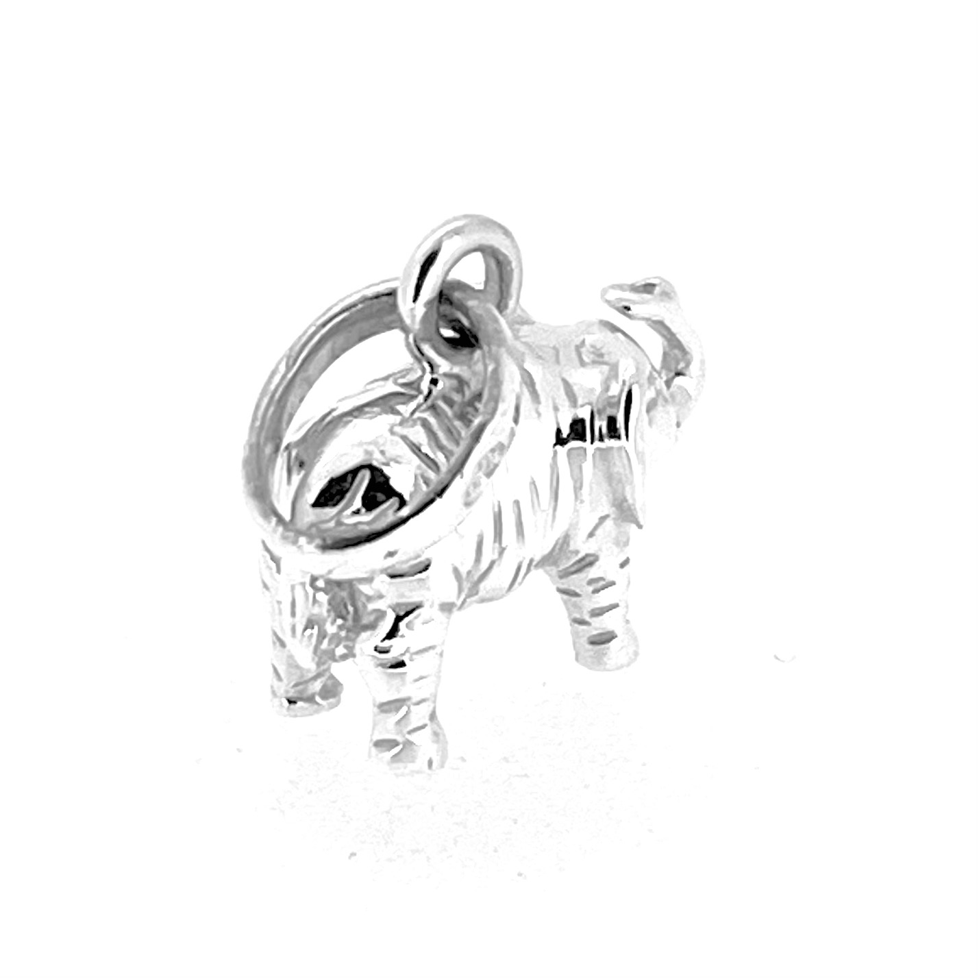 Side view of Links of London elephant charm showing textured body