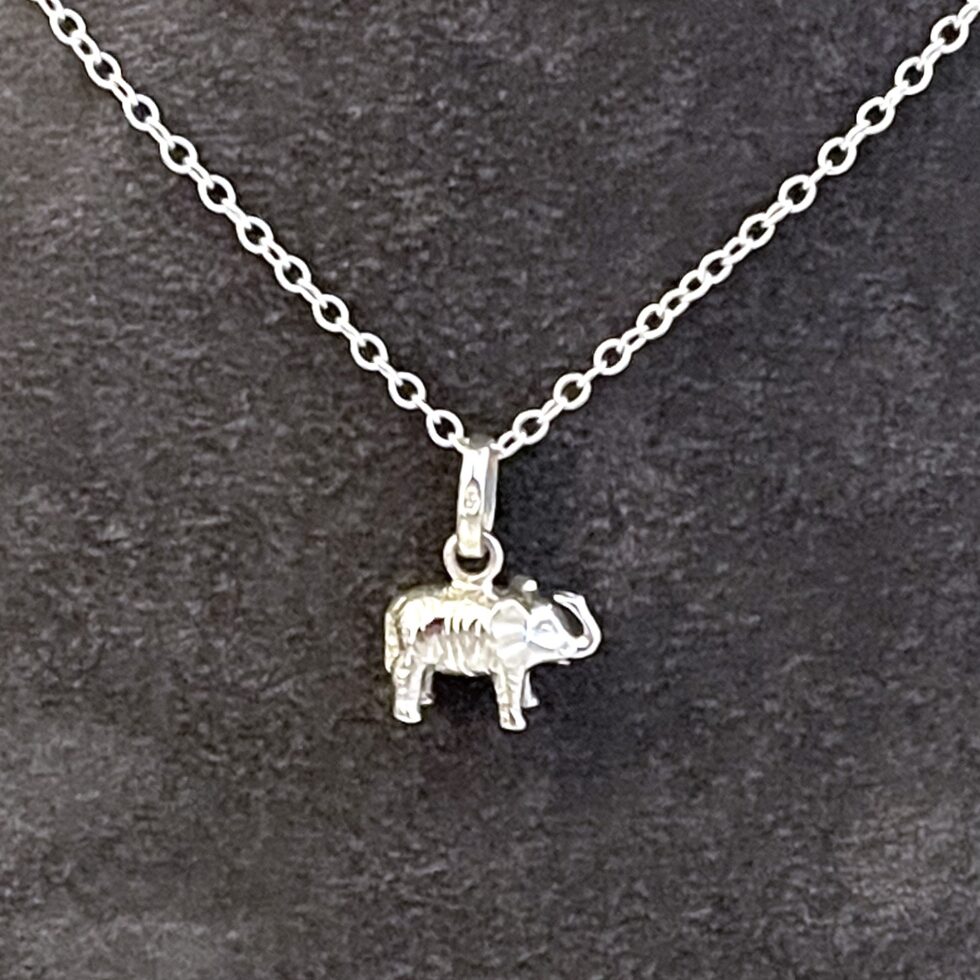 Vintage sterling silver elephant necklace with raised trunk