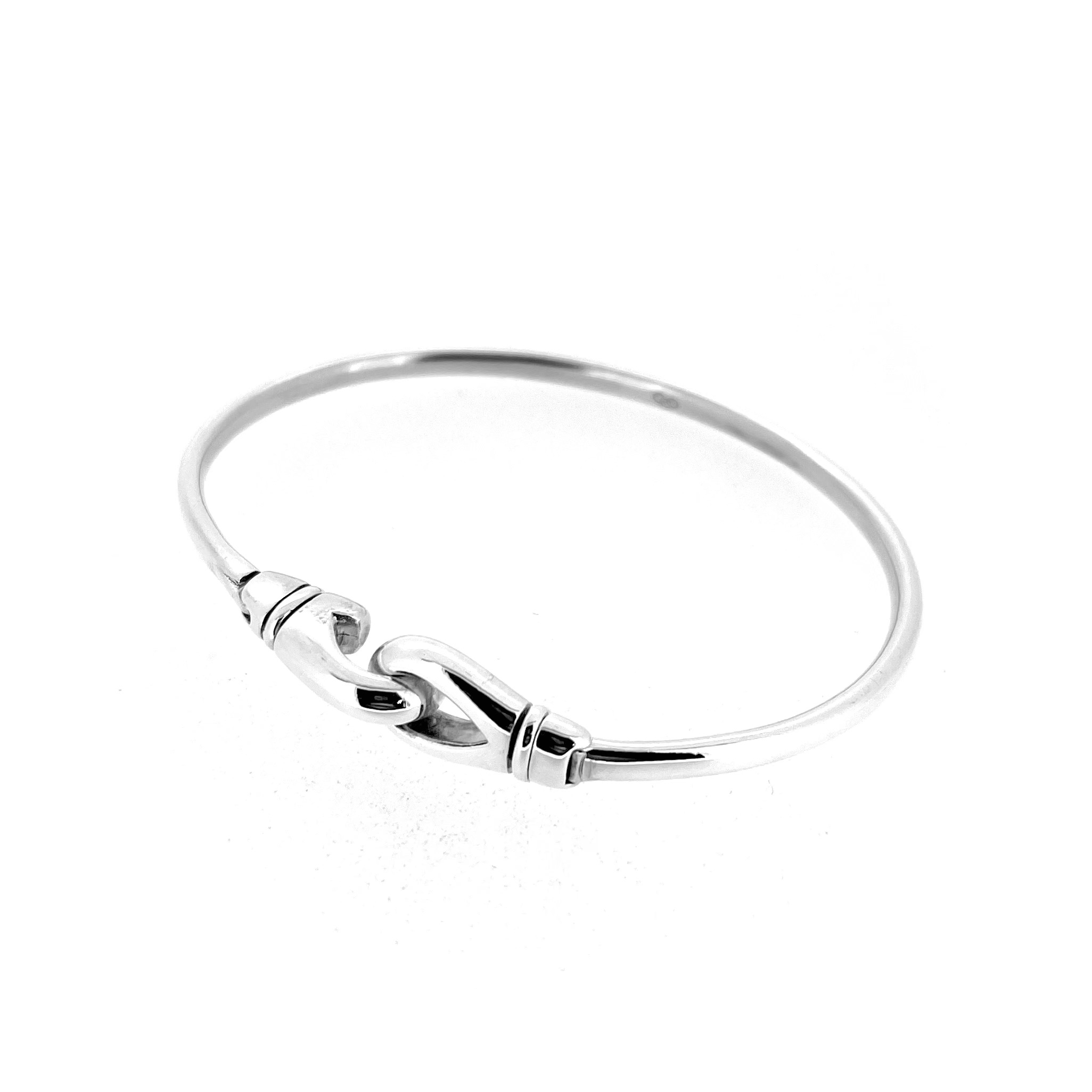 Close-up of oval clasp element on sterling silver Karabiner Bangle