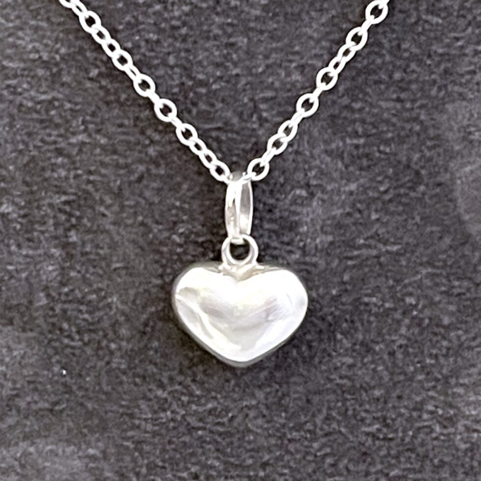 Sterling silver heart necklace with rounded sculptural profile front view