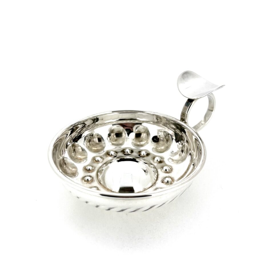 Close-up of Links London hallmarks on the handle of the silver tastevin