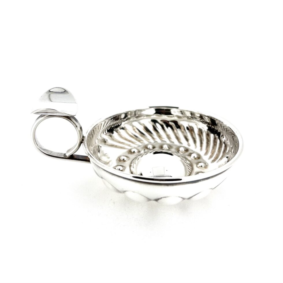 Links of London sterling silver tastevin showing textured interior and ring handle