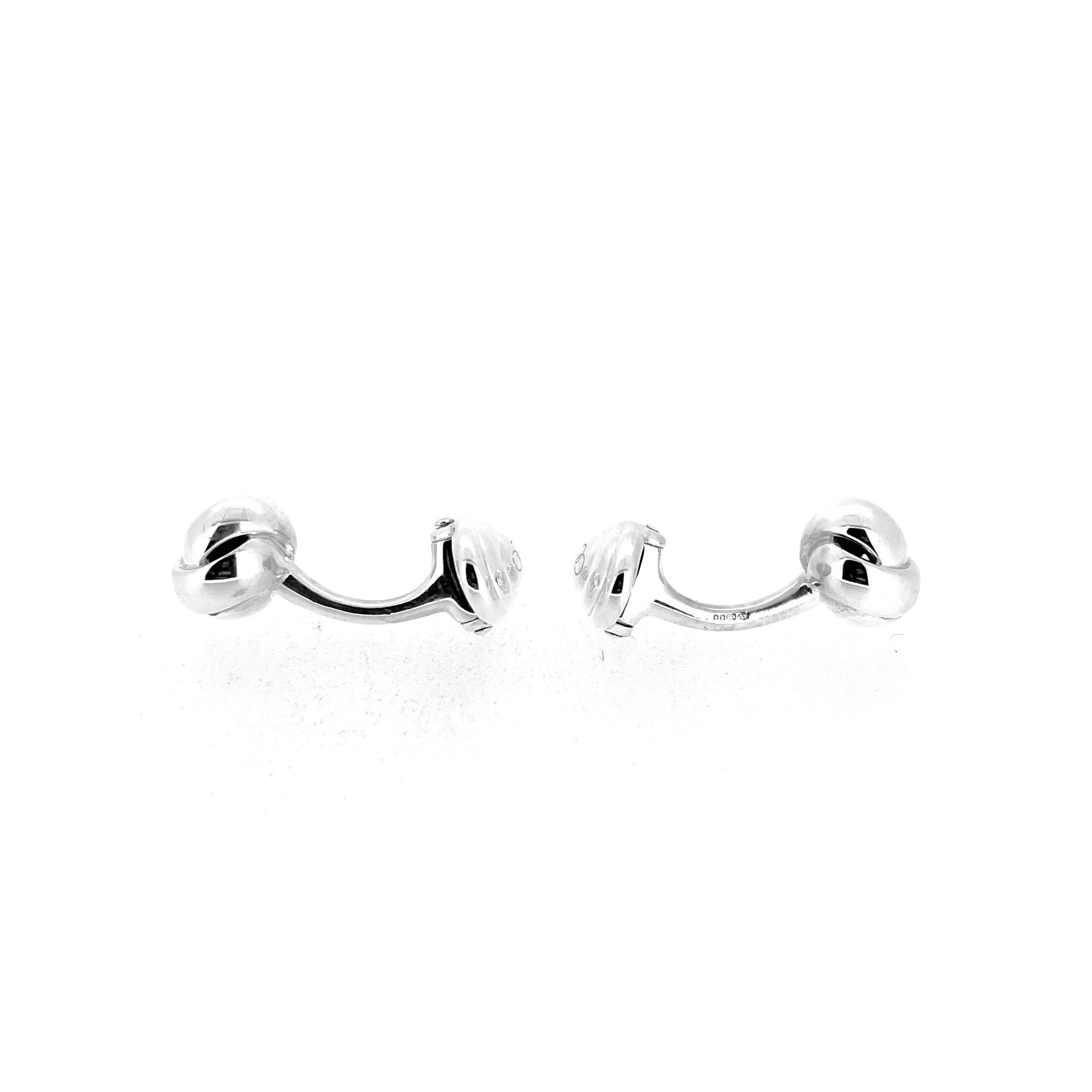 Knot cufflinks showing curved bar and oval swivel backs