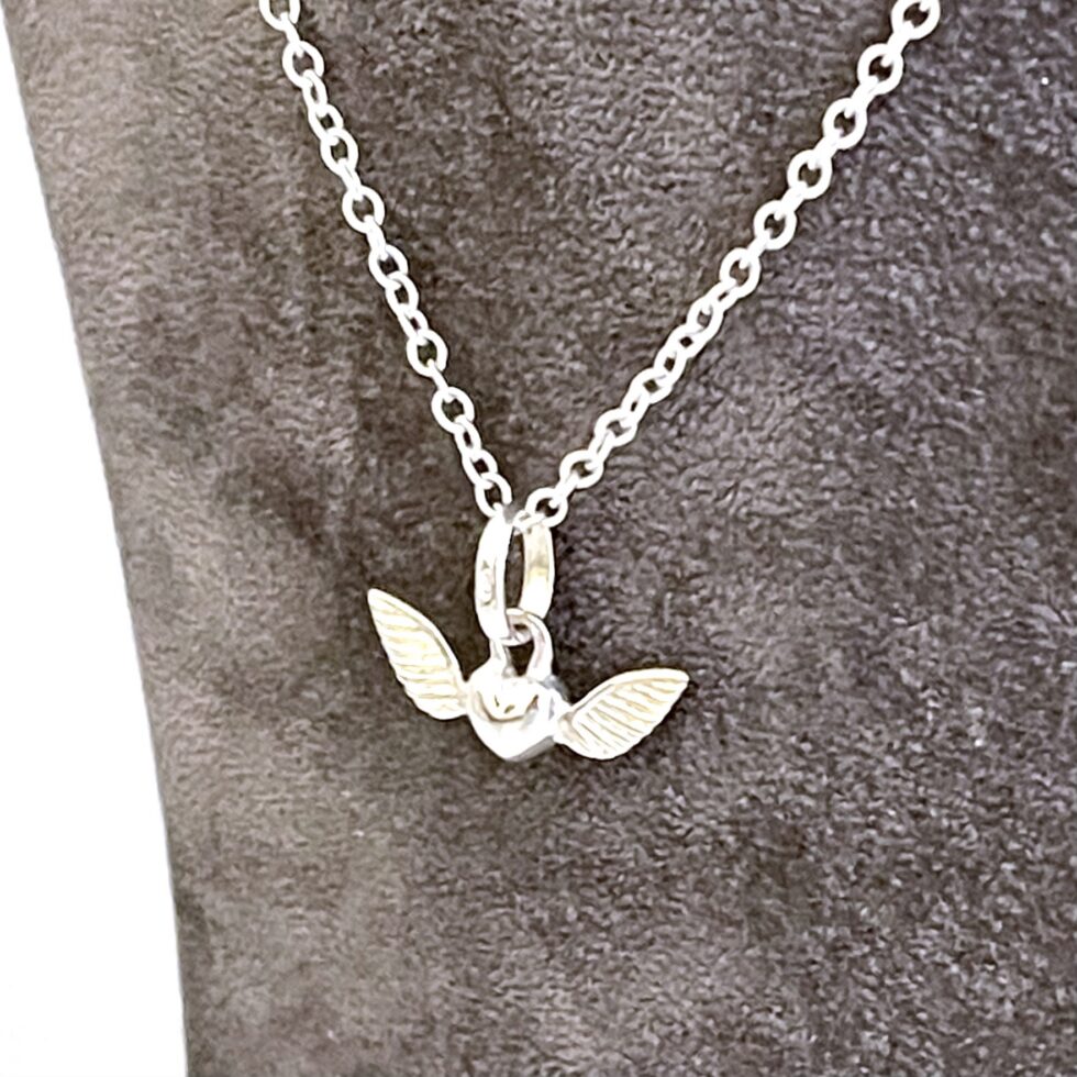 Vintage sterling silver Winged Heart necklace with polished finish