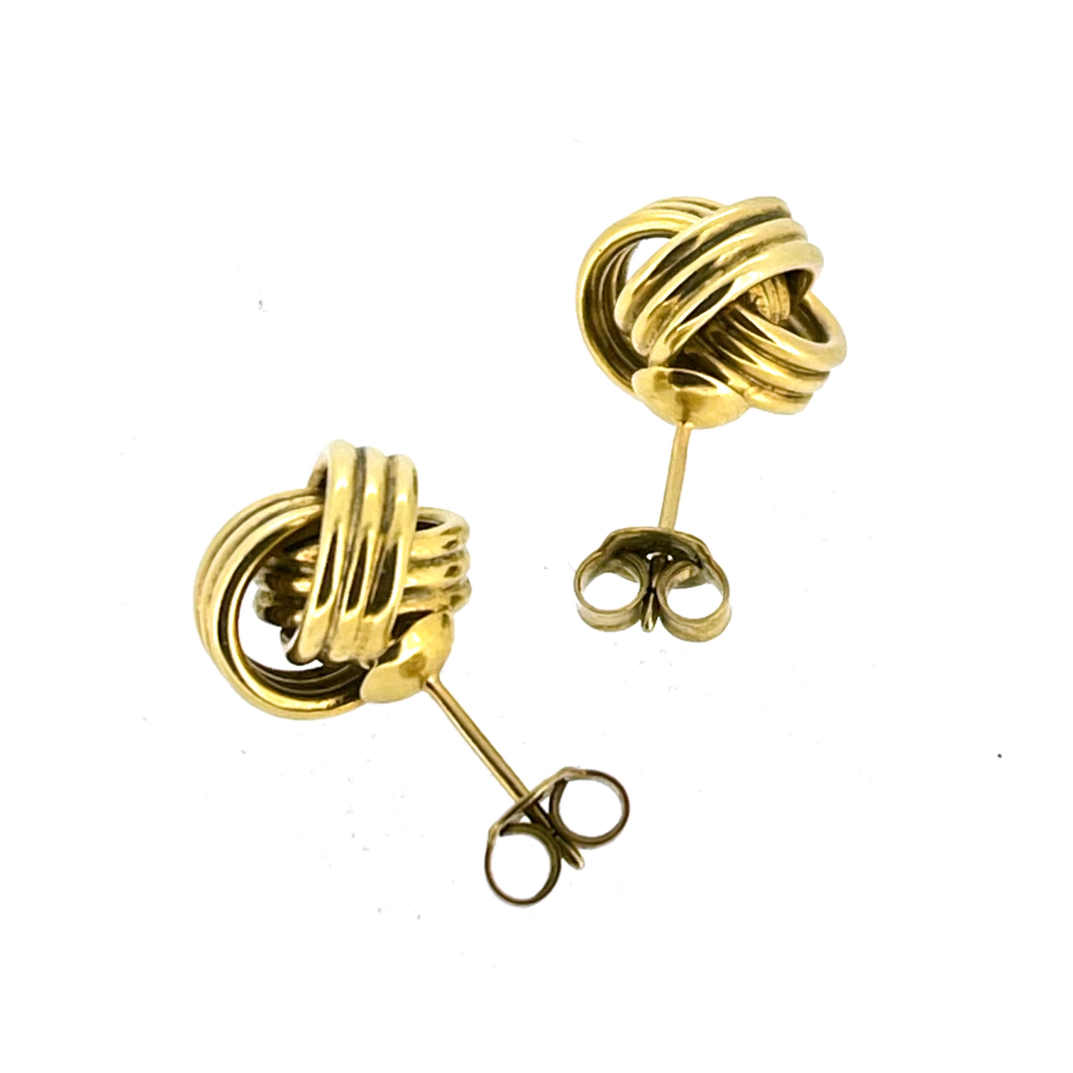 Vintage gold vermeil knot studs showing medium to large scale