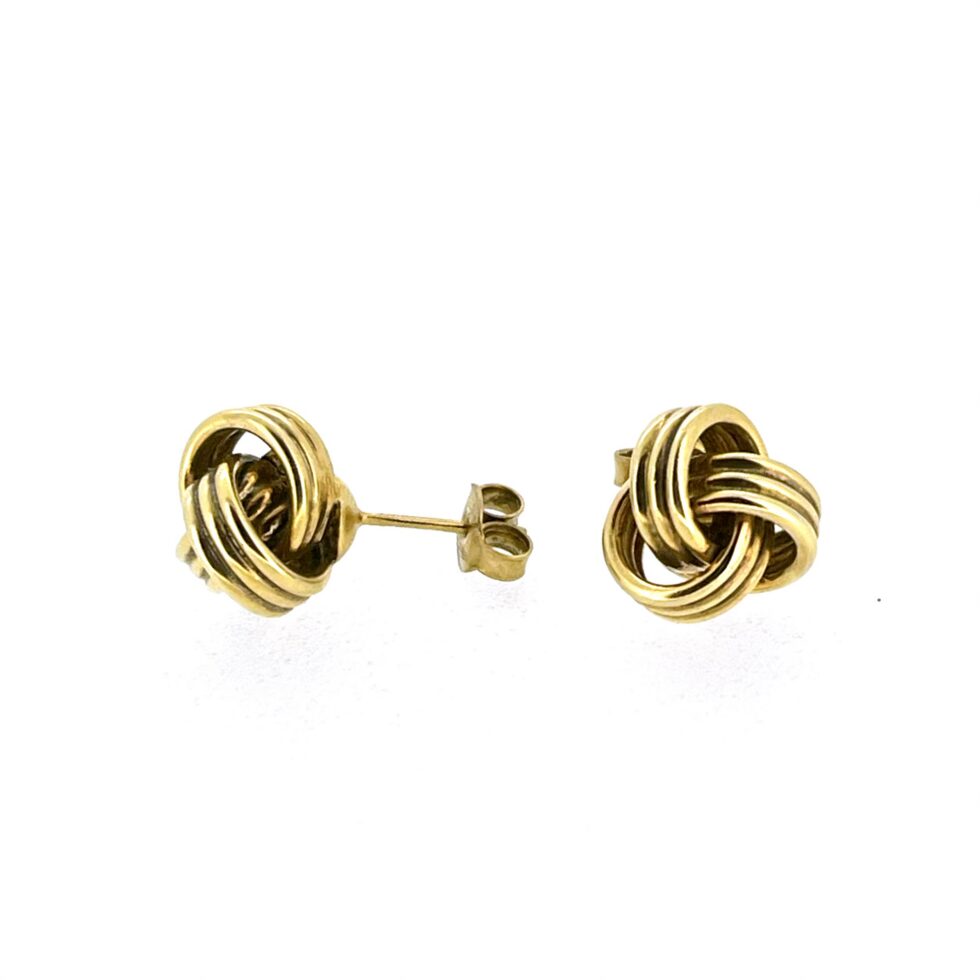 Links of London knot stud earrings showing polished gold finish