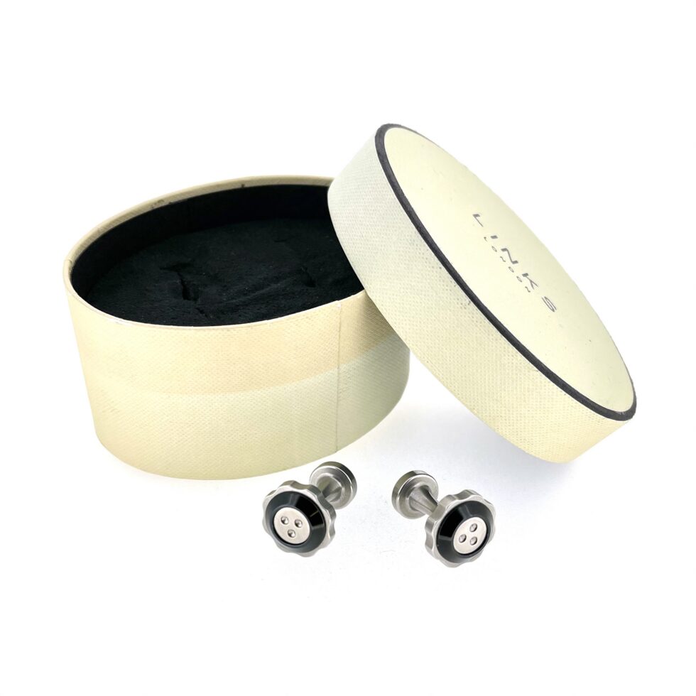 Vintage McLaren cufflinks presented with aged original storage box