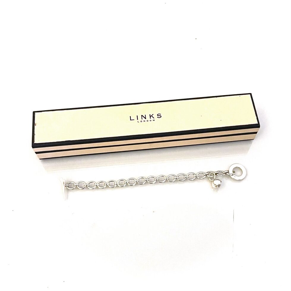 Sterling silver bracelet with Concorde aircraft clasp and apple charm