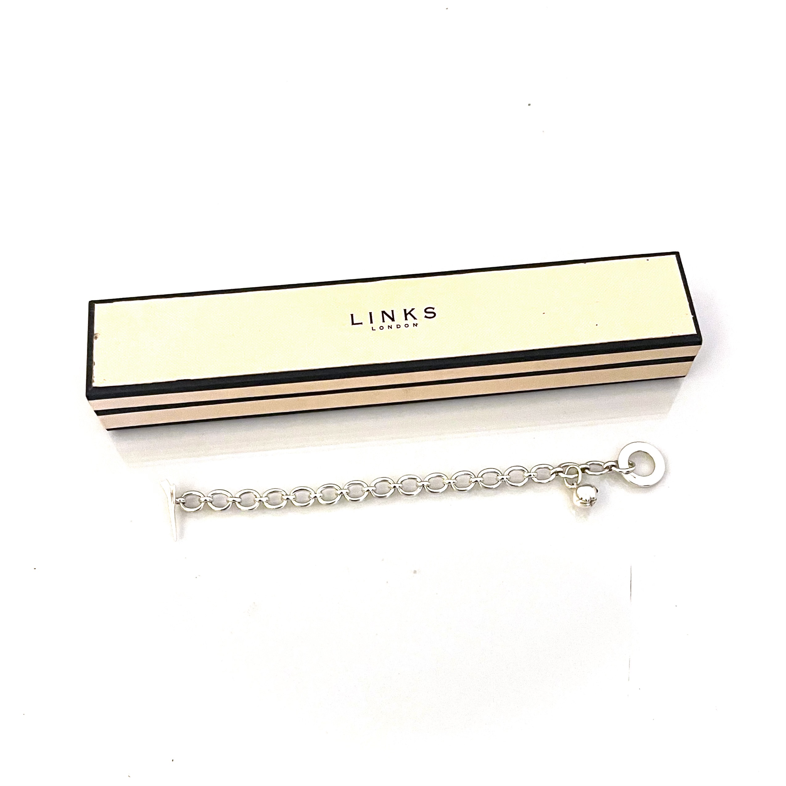 Sterling silver bracelet with Concorde aircraft clasp and apple charm