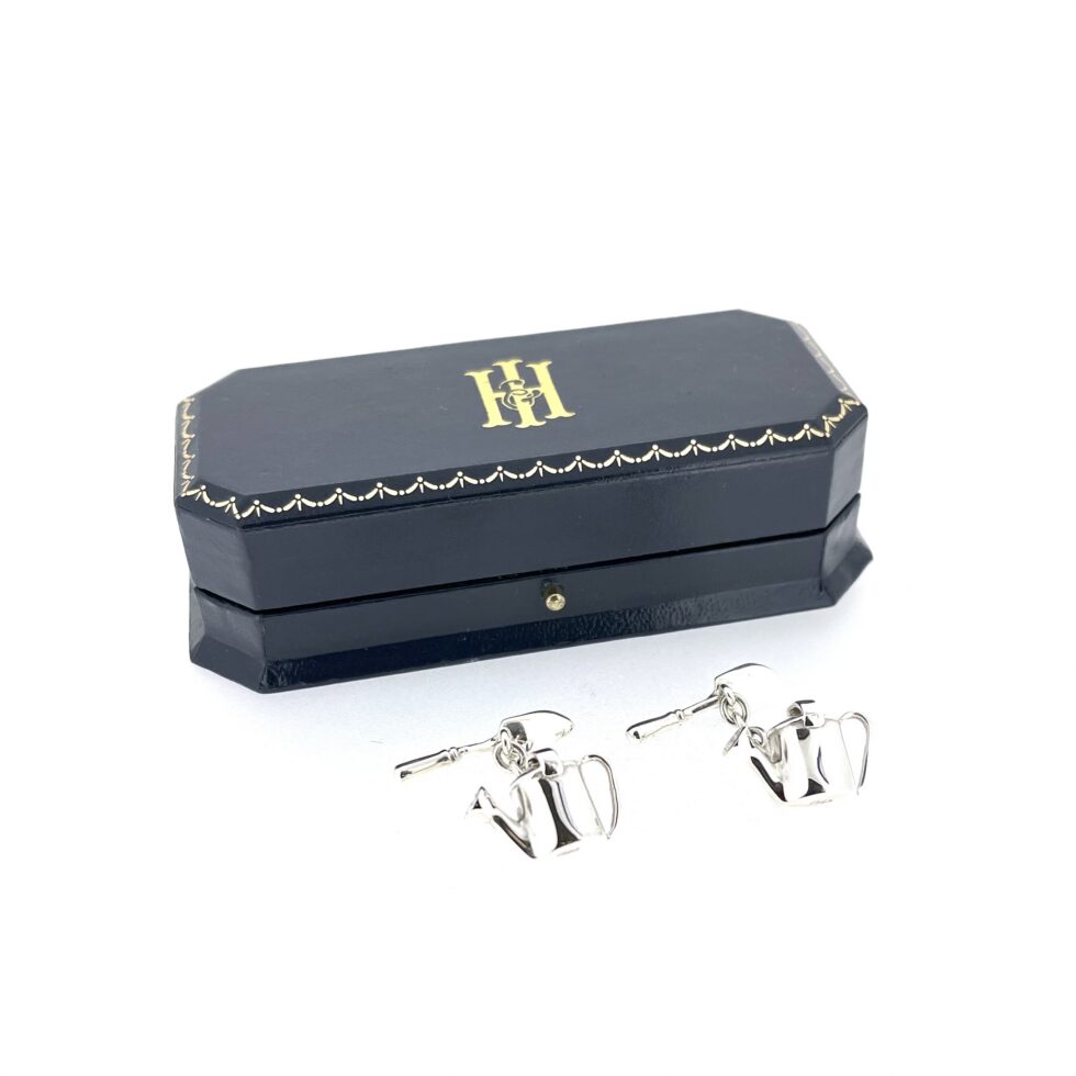 Detailed view of Links of London gardening cufflinks with pierced sprinkler heads