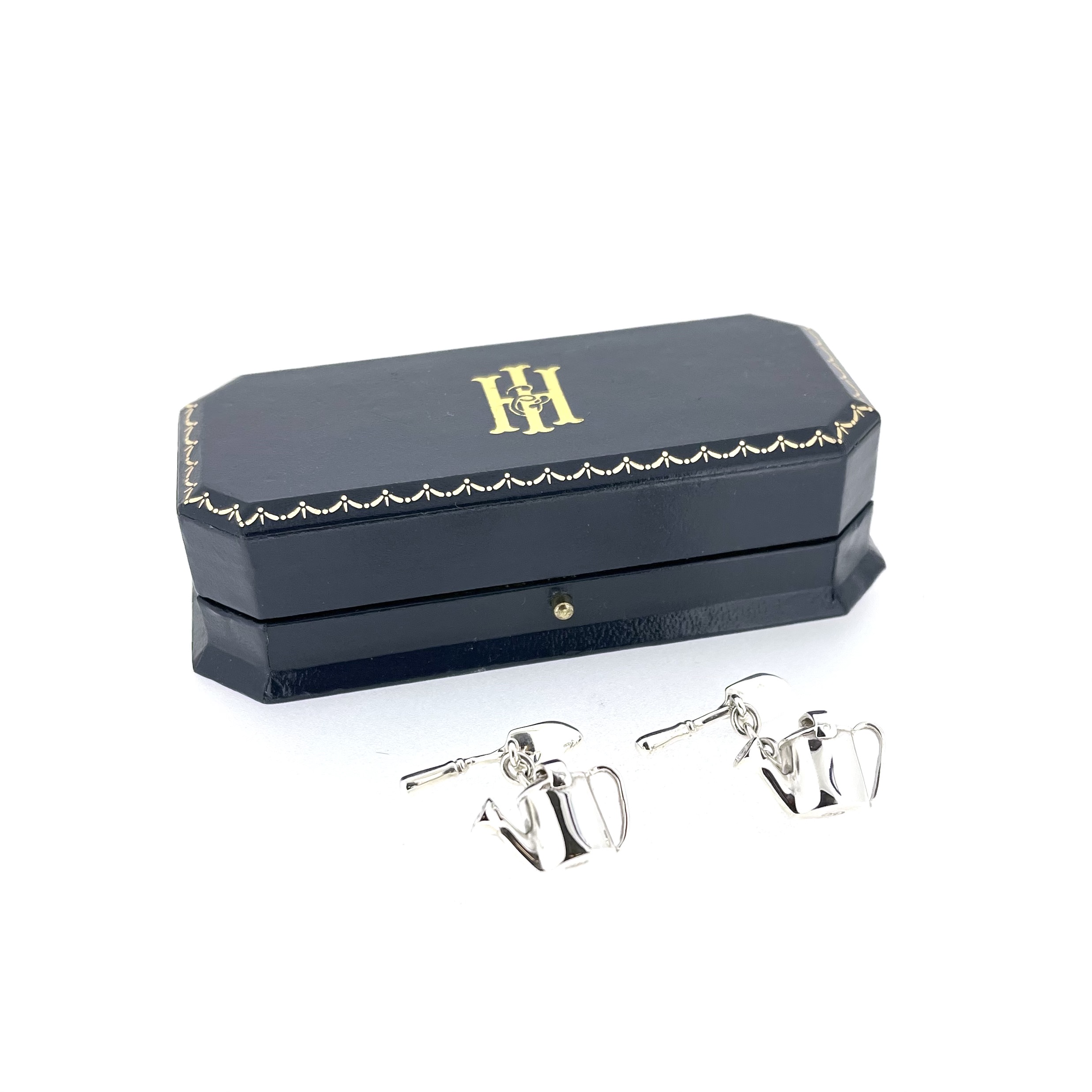 Detailed view of Links of London gardening cufflinks with pierced sprinkler heads