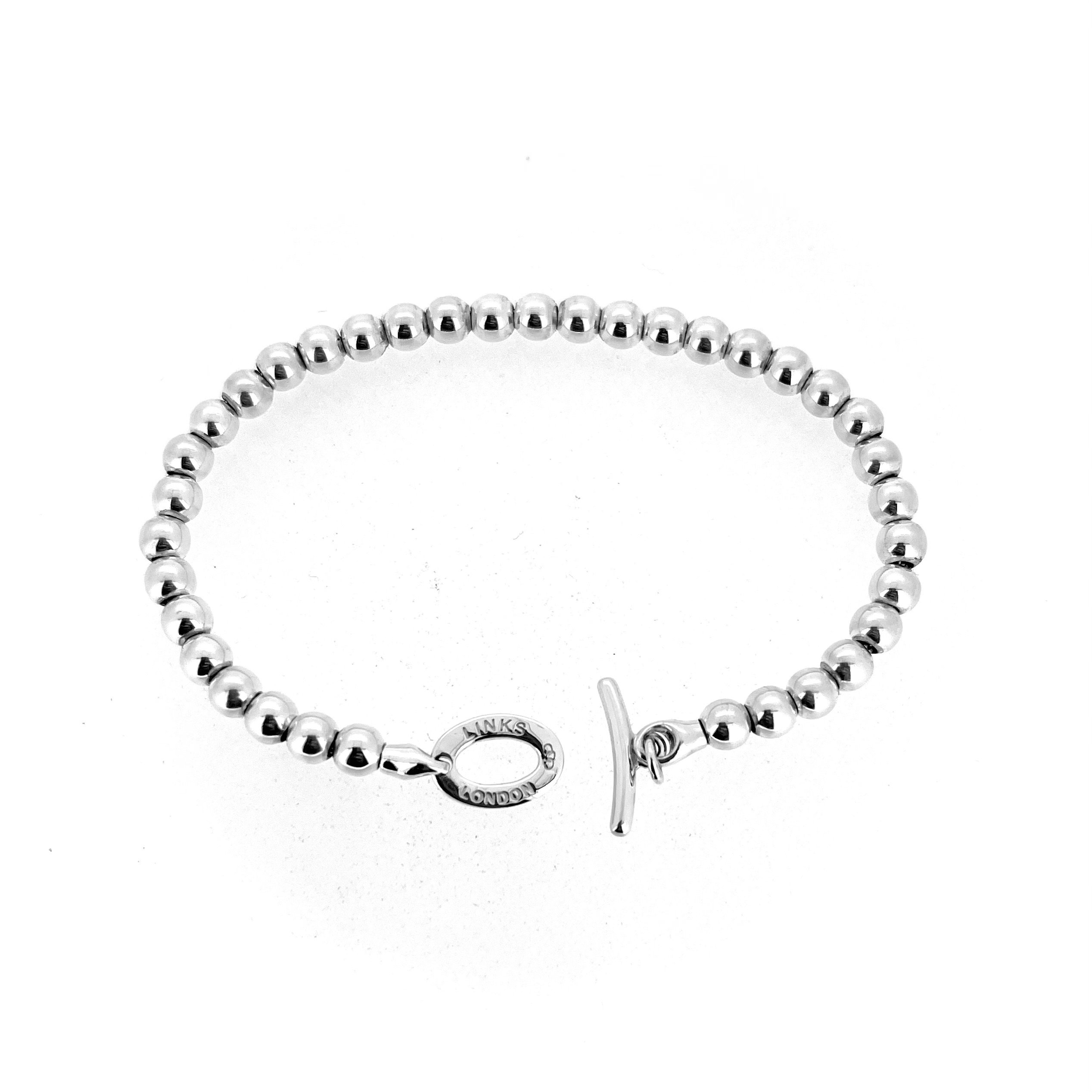 Vintage sterling silver bead bracelet with polished round beads and toggle fastening