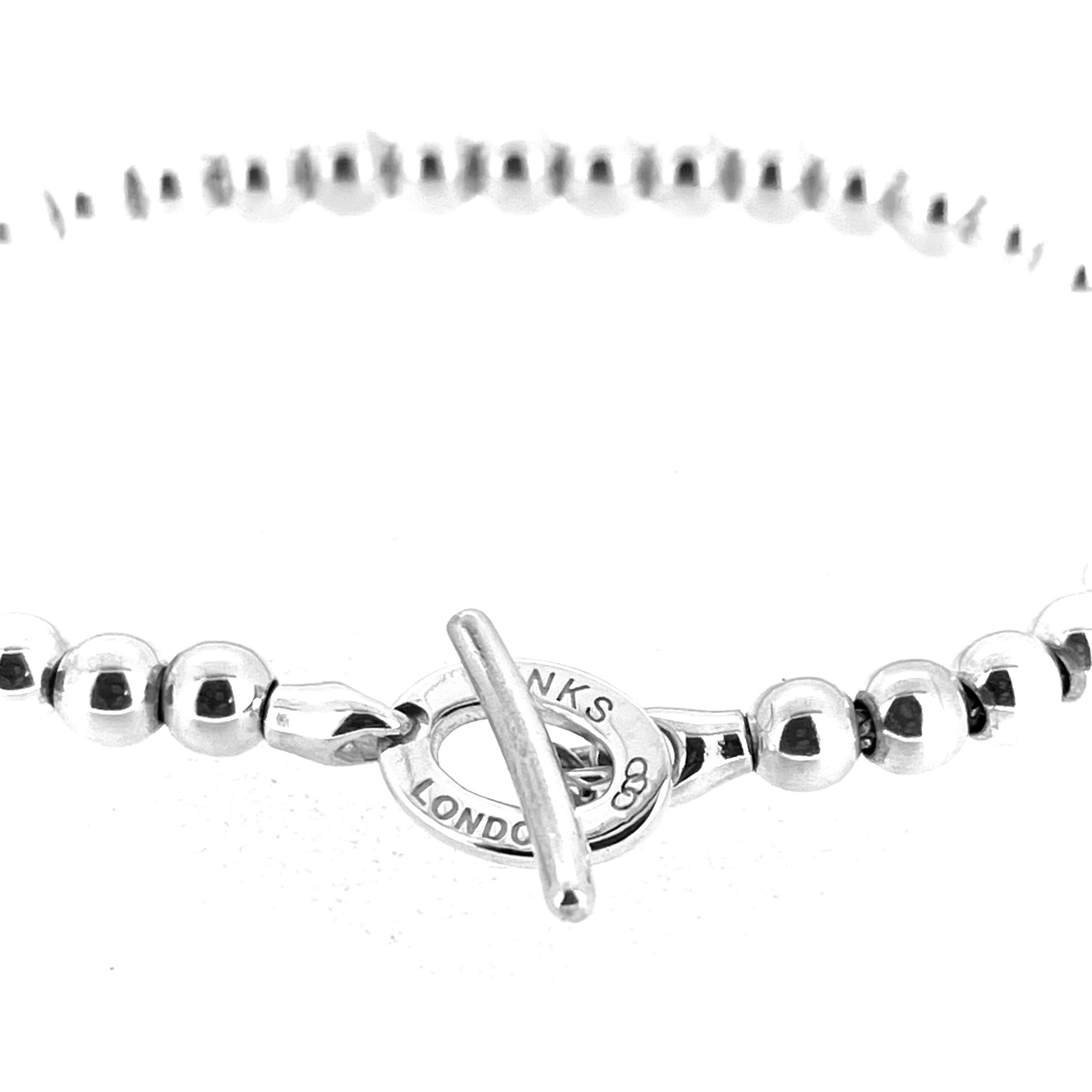 Side angle of vintage sterling silver bead toggle bracelet