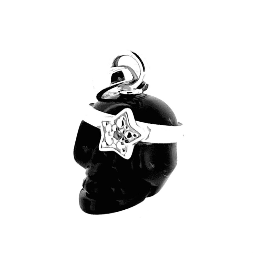 Side view of Links of London black agate skull charm with silver star