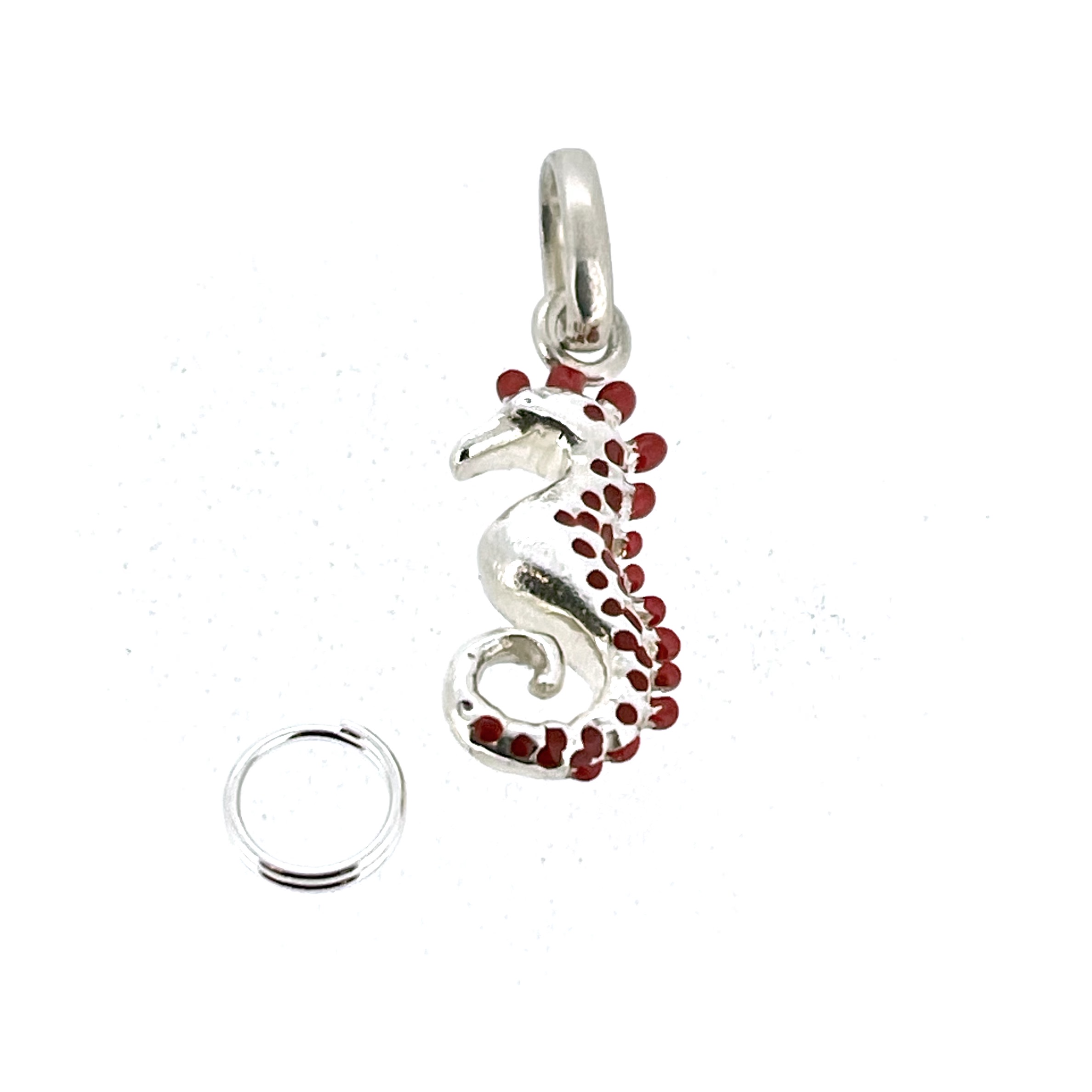 Small sterling silver seahorse charm with red enamel spots